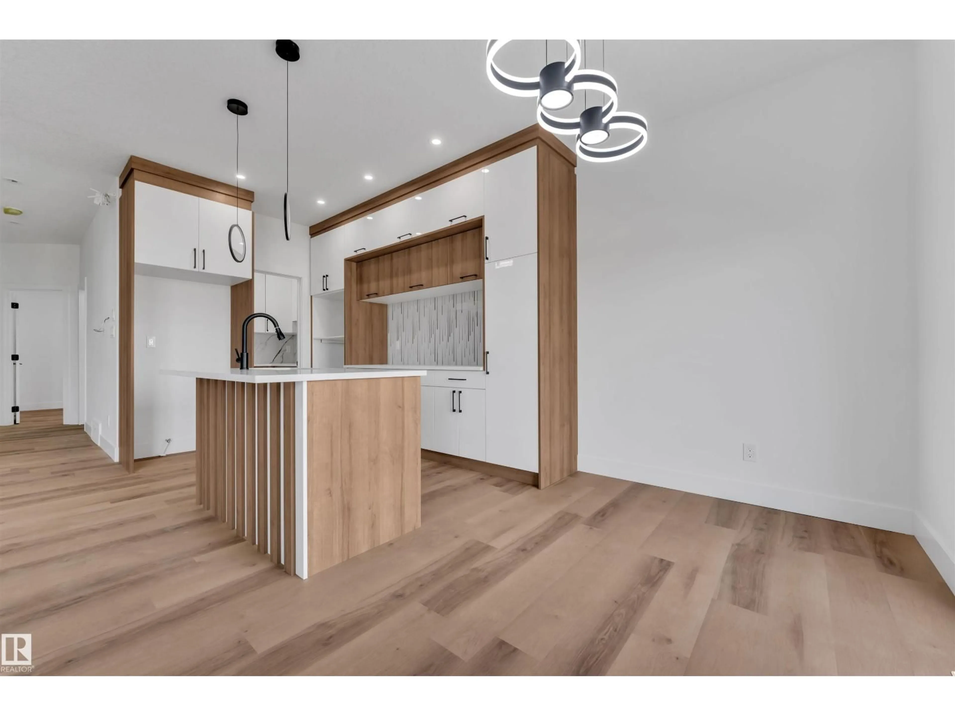 Open concept kitchen, wood/laminate floor for NW - 1908 155 AV, Edmonton Alberta T5Y4H8