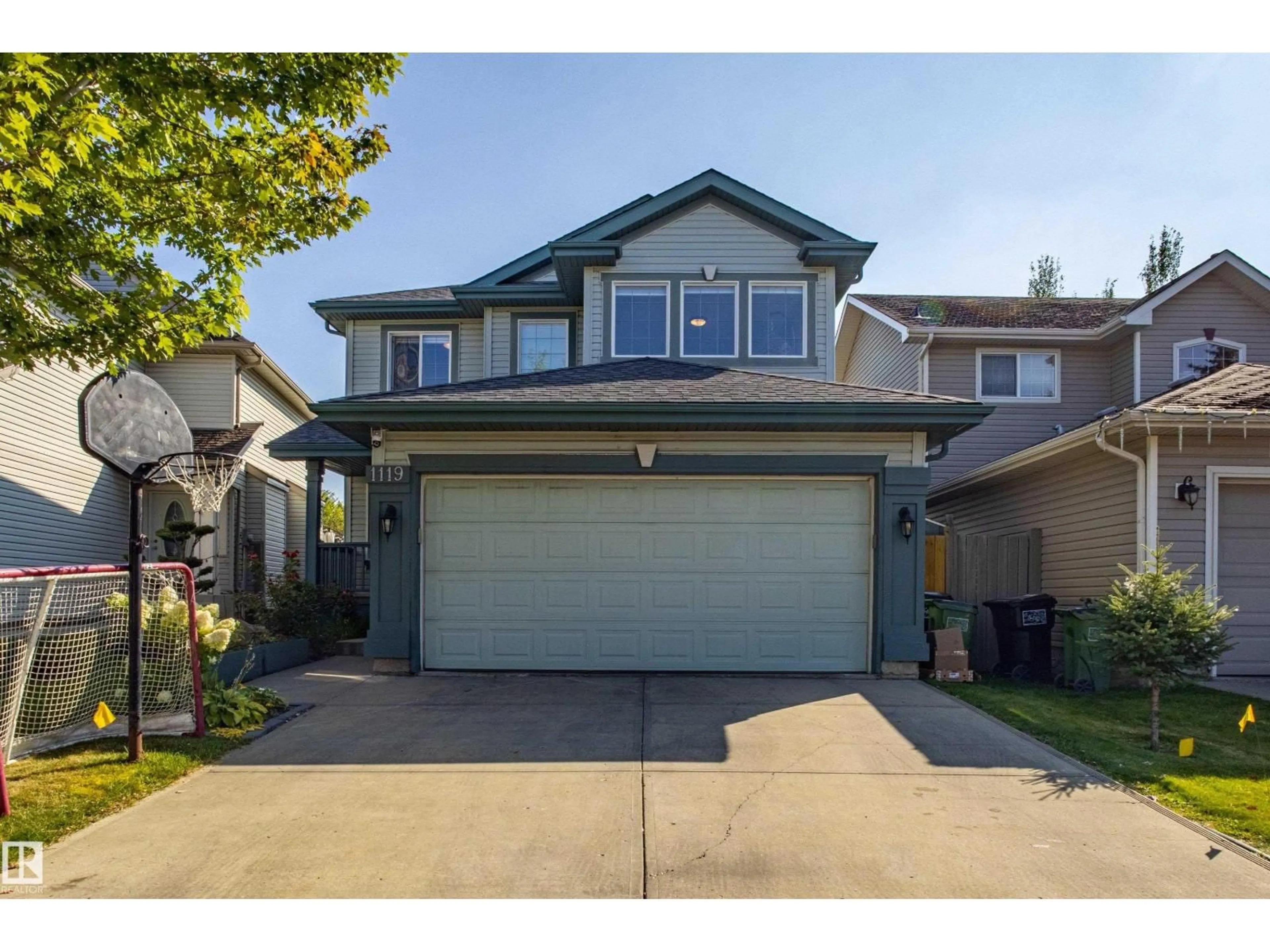 Home with vinyl exterior material, street for 1119 114 ST, Edmonton Alberta T6W1P6