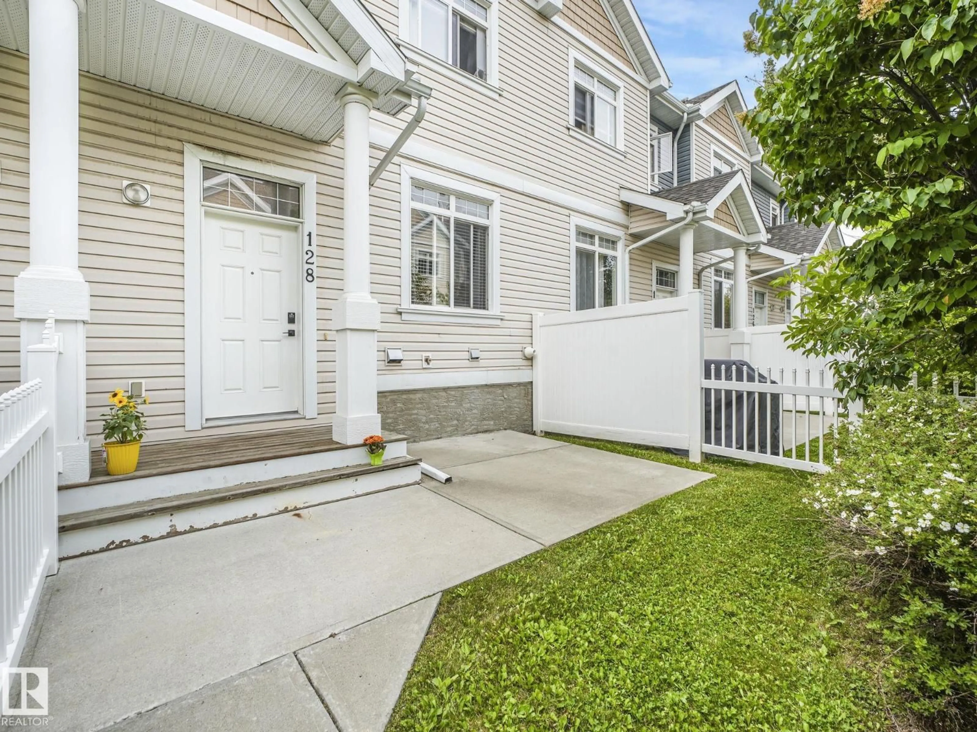 Home with vinyl exterior material, street for #128 - 1804 70 ST, Edmonton Alberta T6X0H4