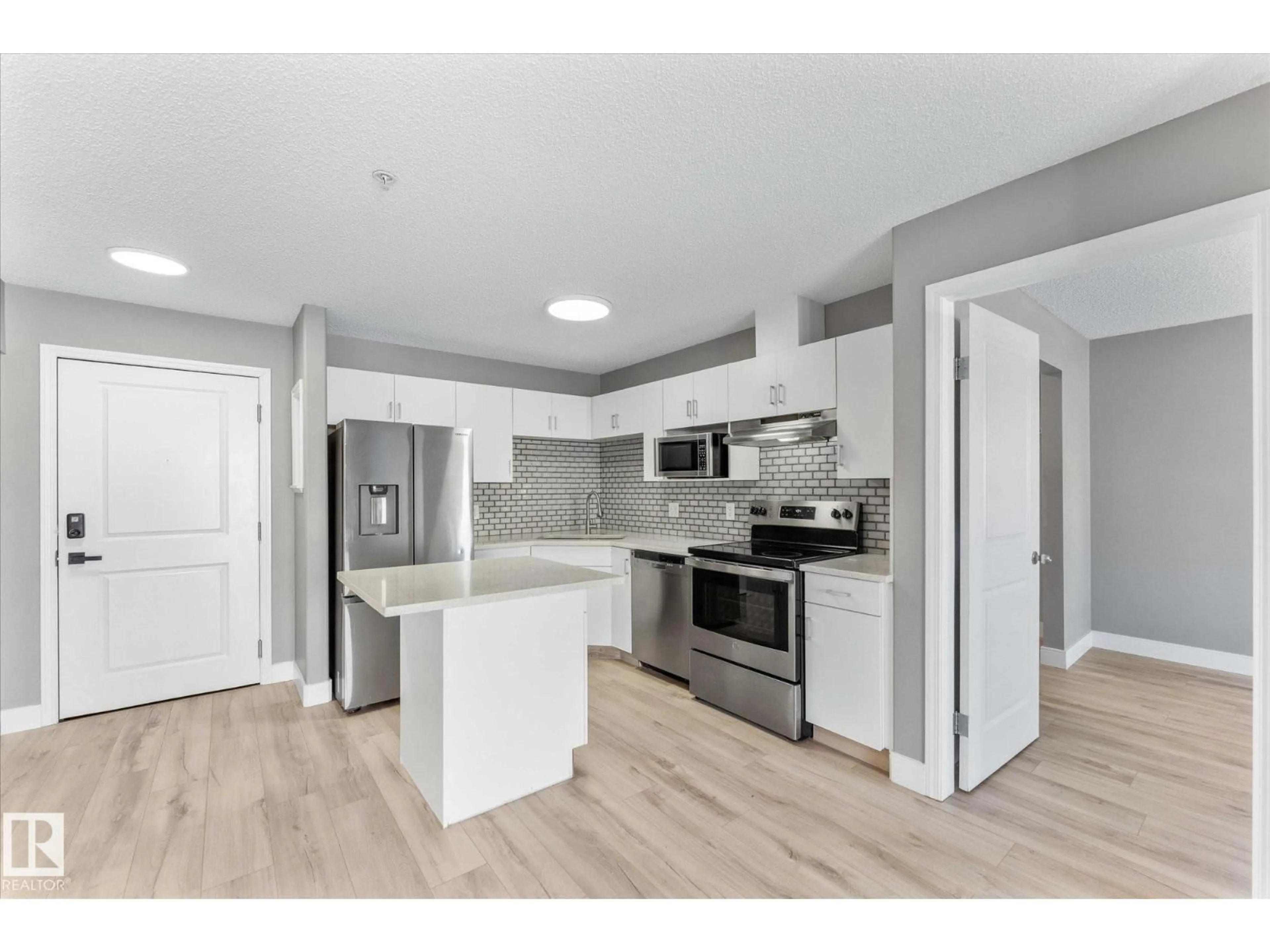 Open concept kitchen, unknown for #115 - 16221 95 ST, Edmonton Alberta T5Z3V3