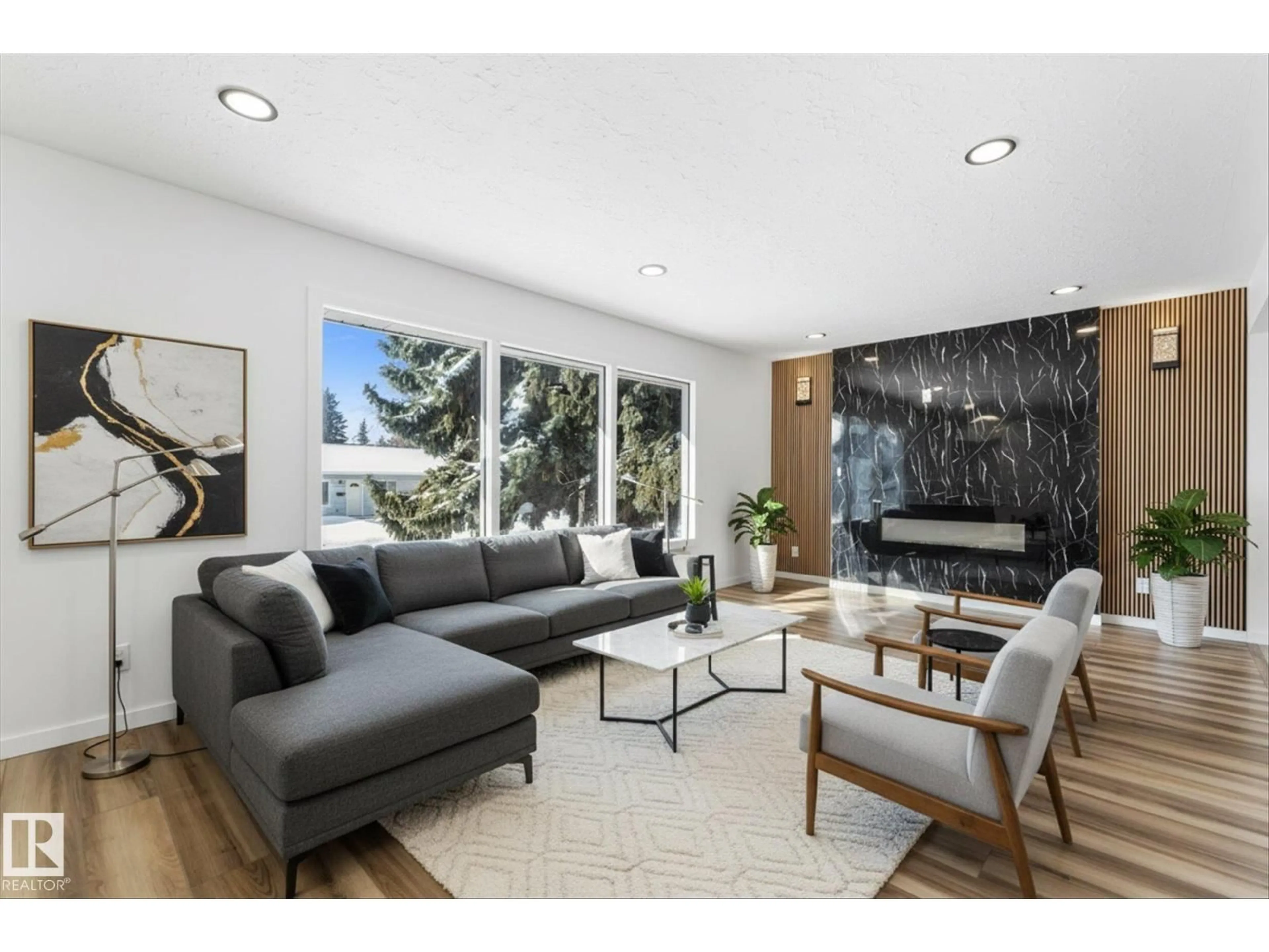 Living room with furniture, wood/laminate floor for 13116 128A AV, Edmonton Alberta T5L3H9