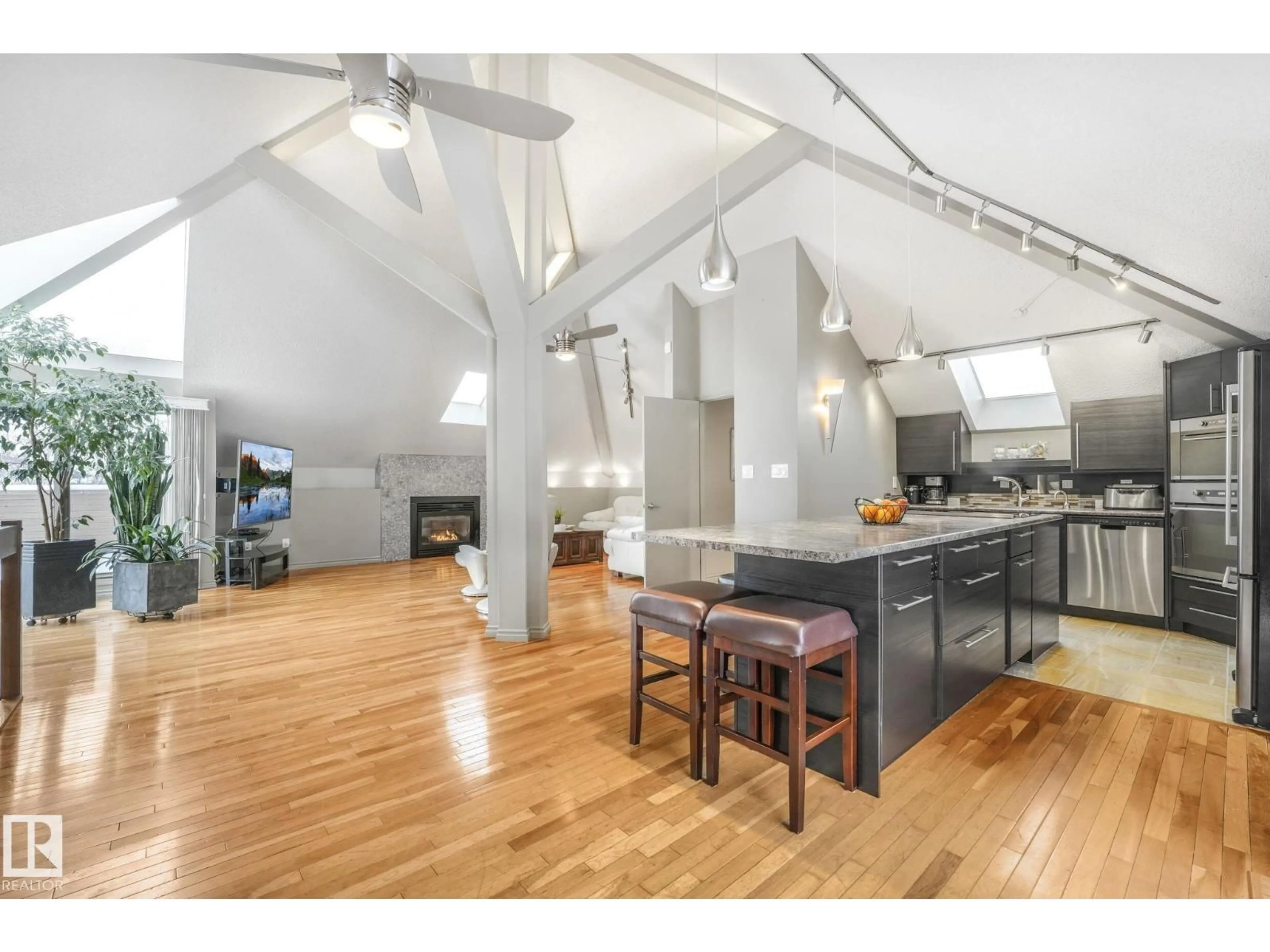 Open concept kitchen, wood/laminate floor for NW - 5807 185 ST, Edmonton Alberta T6M1Y1