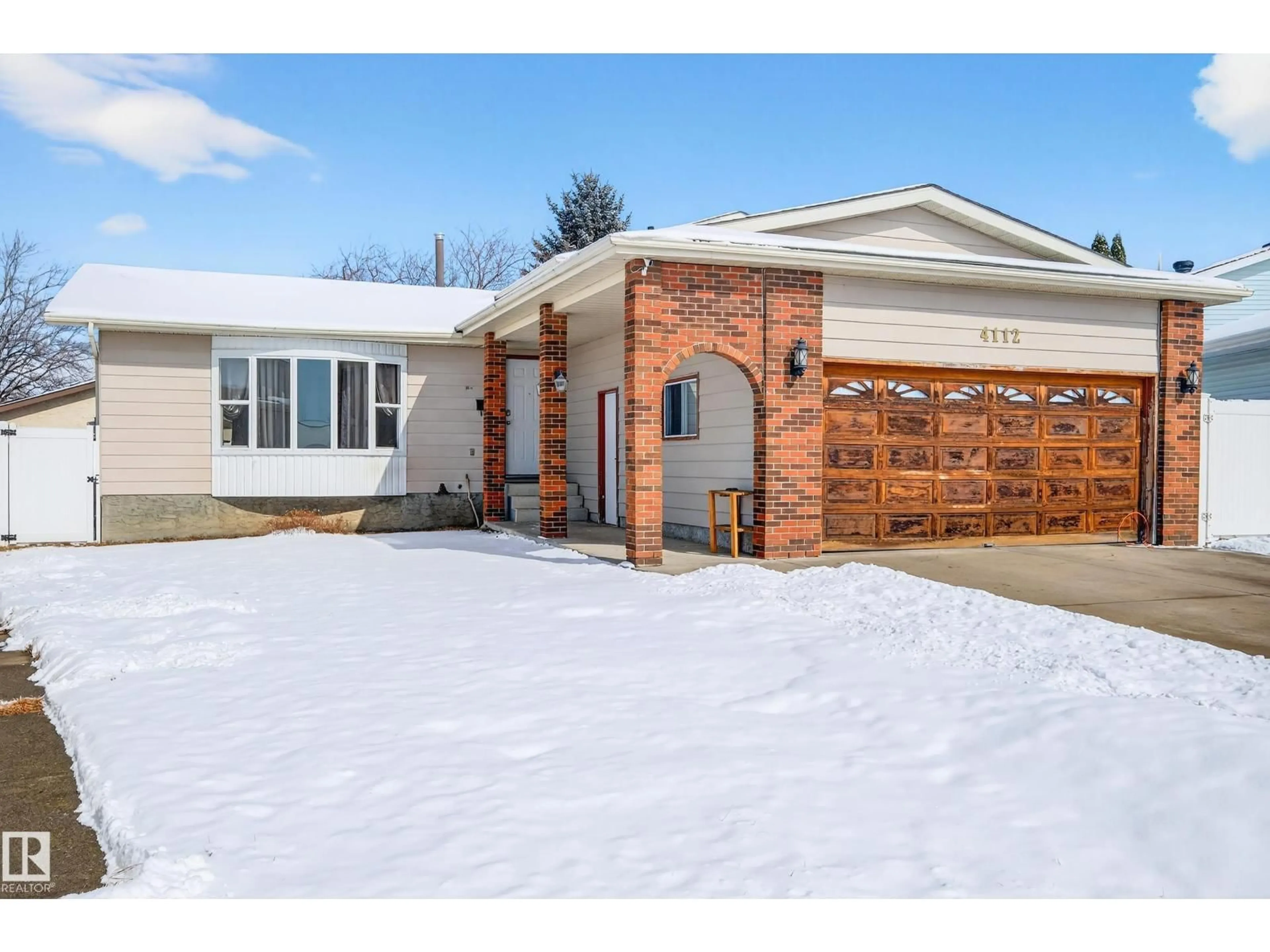 Home with brick exterior material, street for 4112 30 AV, Edmonton Alberta T6L3W4