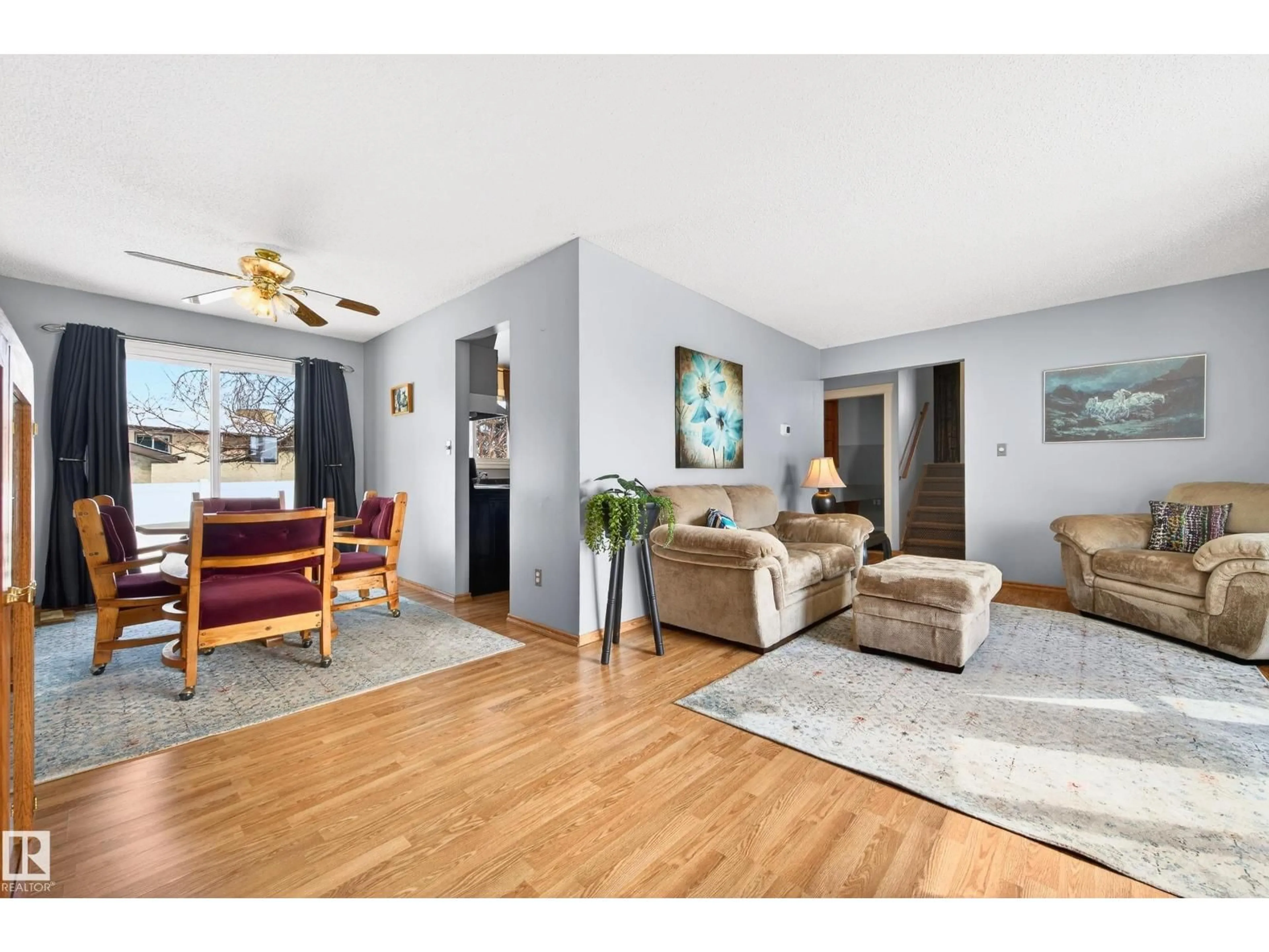 Living room with furniture, wood/laminate floor for 4112 30 AV, Edmonton Alberta T6L3W4