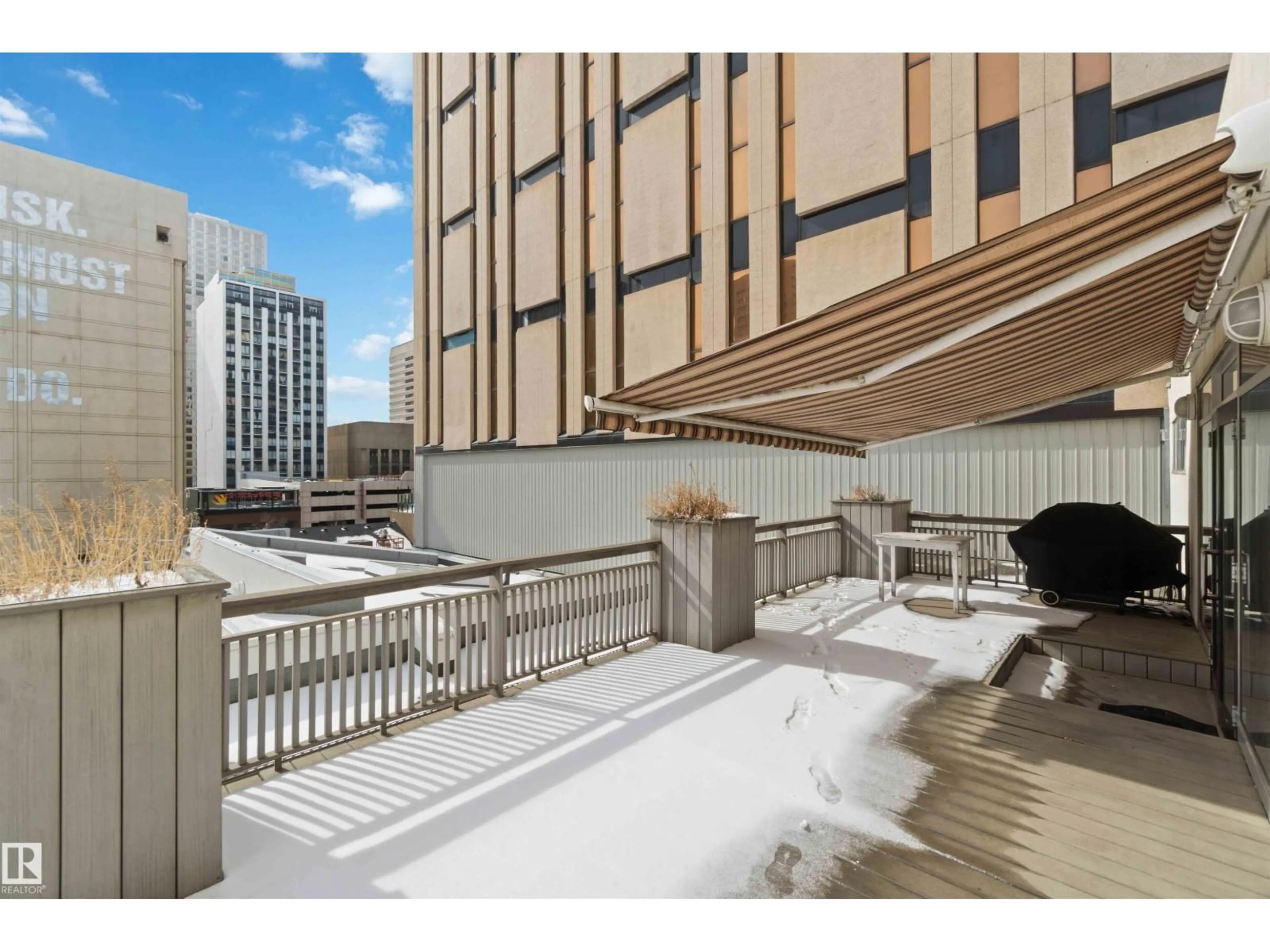 Patio, city buildings view from balcony for 401 - 10009 102 AV, Edmonton Alberta T5J5B6
