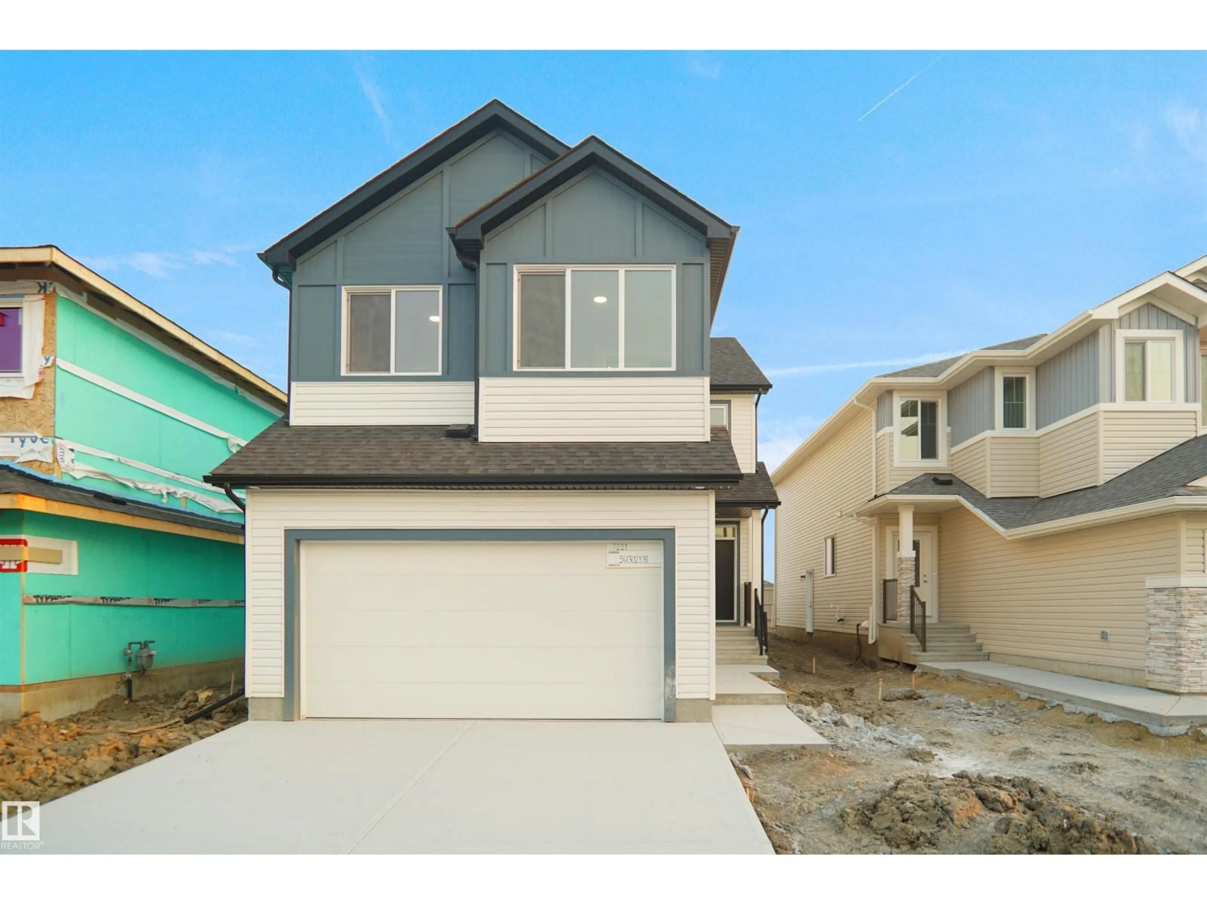 Home with vinyl exterior material, street for NW - 7227 182 AV, Edmonton Alberta T5Z0V6