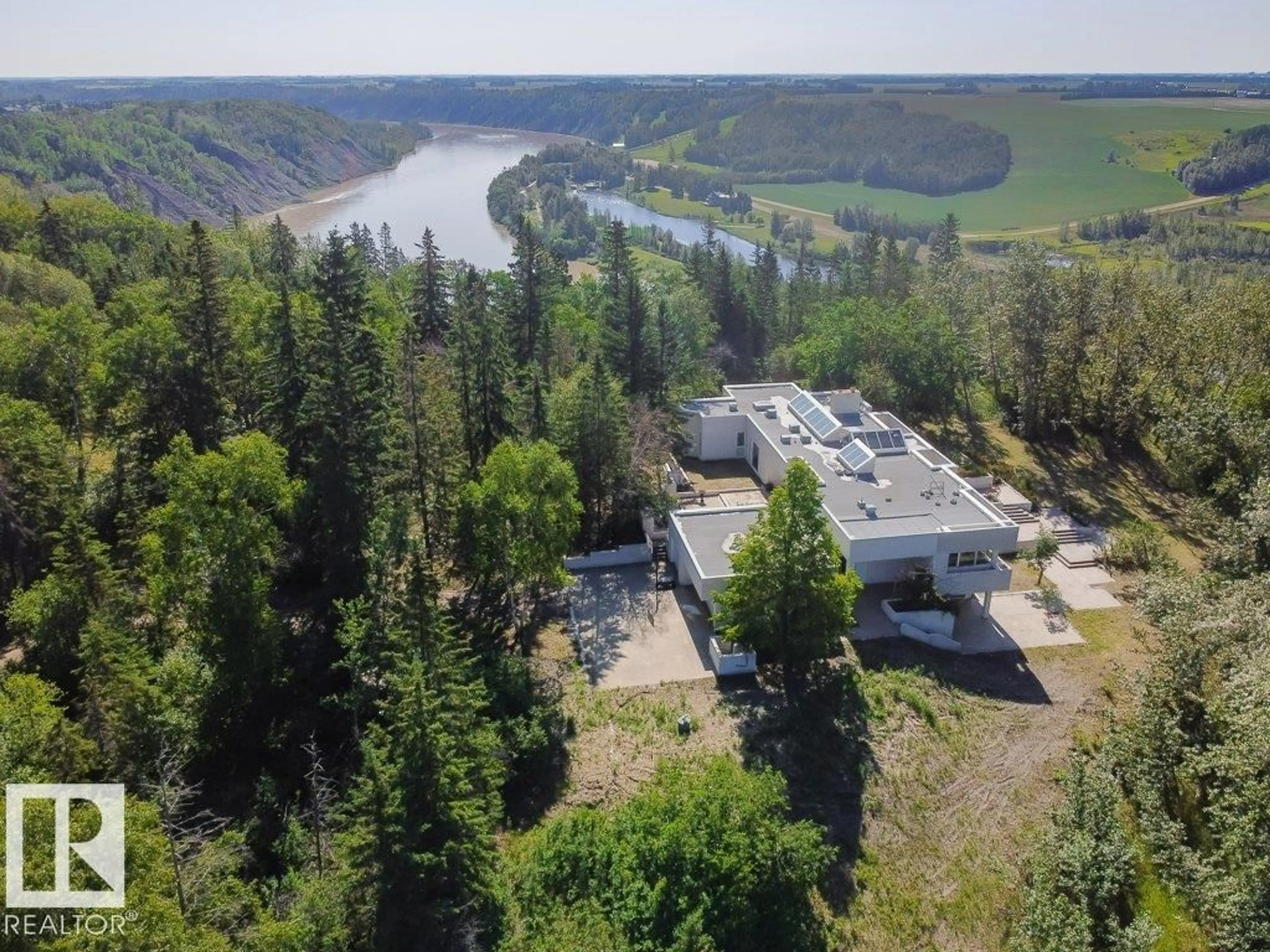 A pic from outside/outdoor area/front of a property/back of a property/a pic from drone, water/lake/river/ocean view for 3A - 51112 RGE RD 260, Rural Parkland County Alberta T7Y1B2