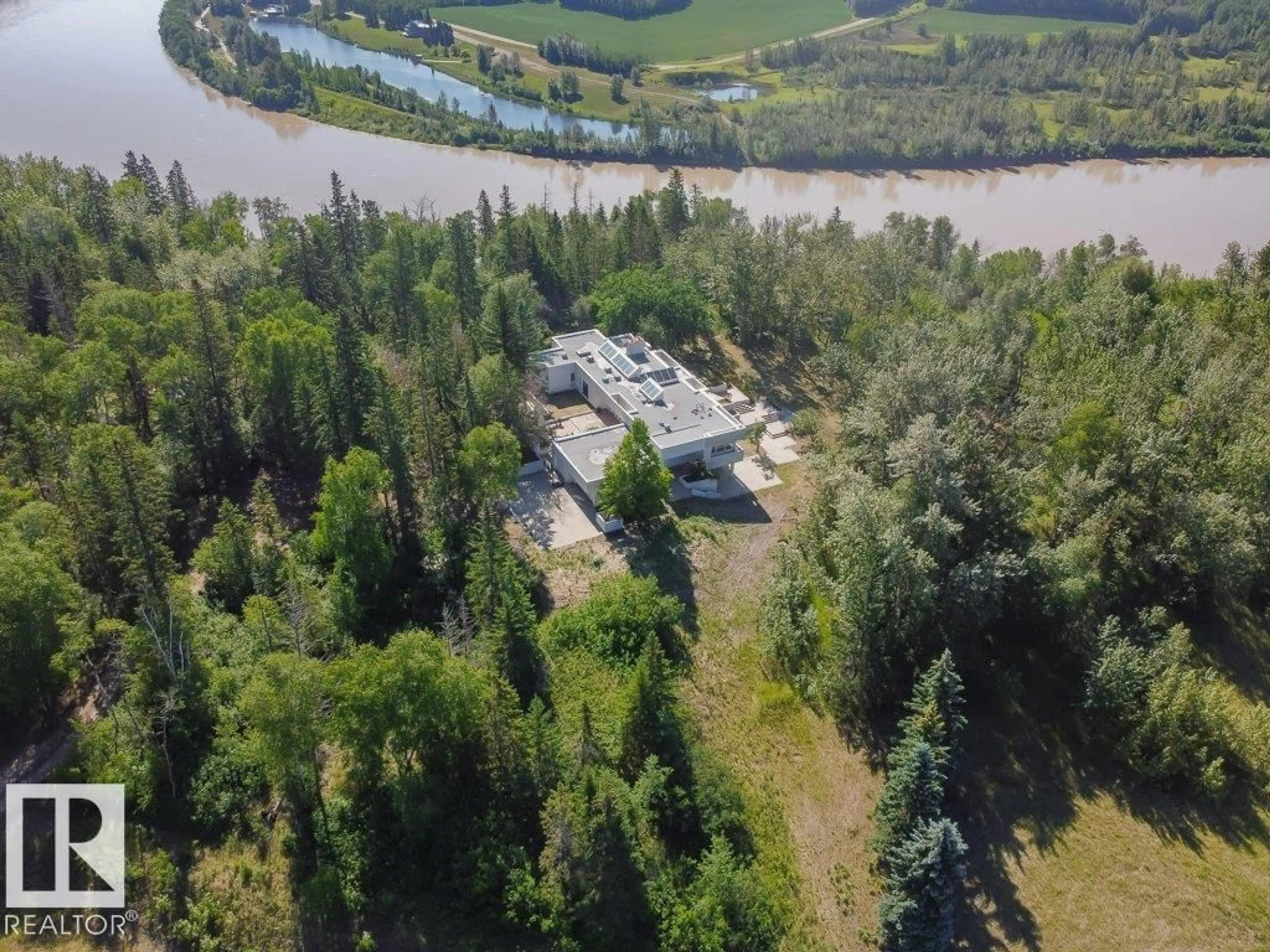 A pic from outside/outdoor area/front of a property/back of a property/a pic from drone, water/lake/river/ocean view for 3A - 51112 RGE RD 260, Rural Parkland County Alberta T7Y1B2