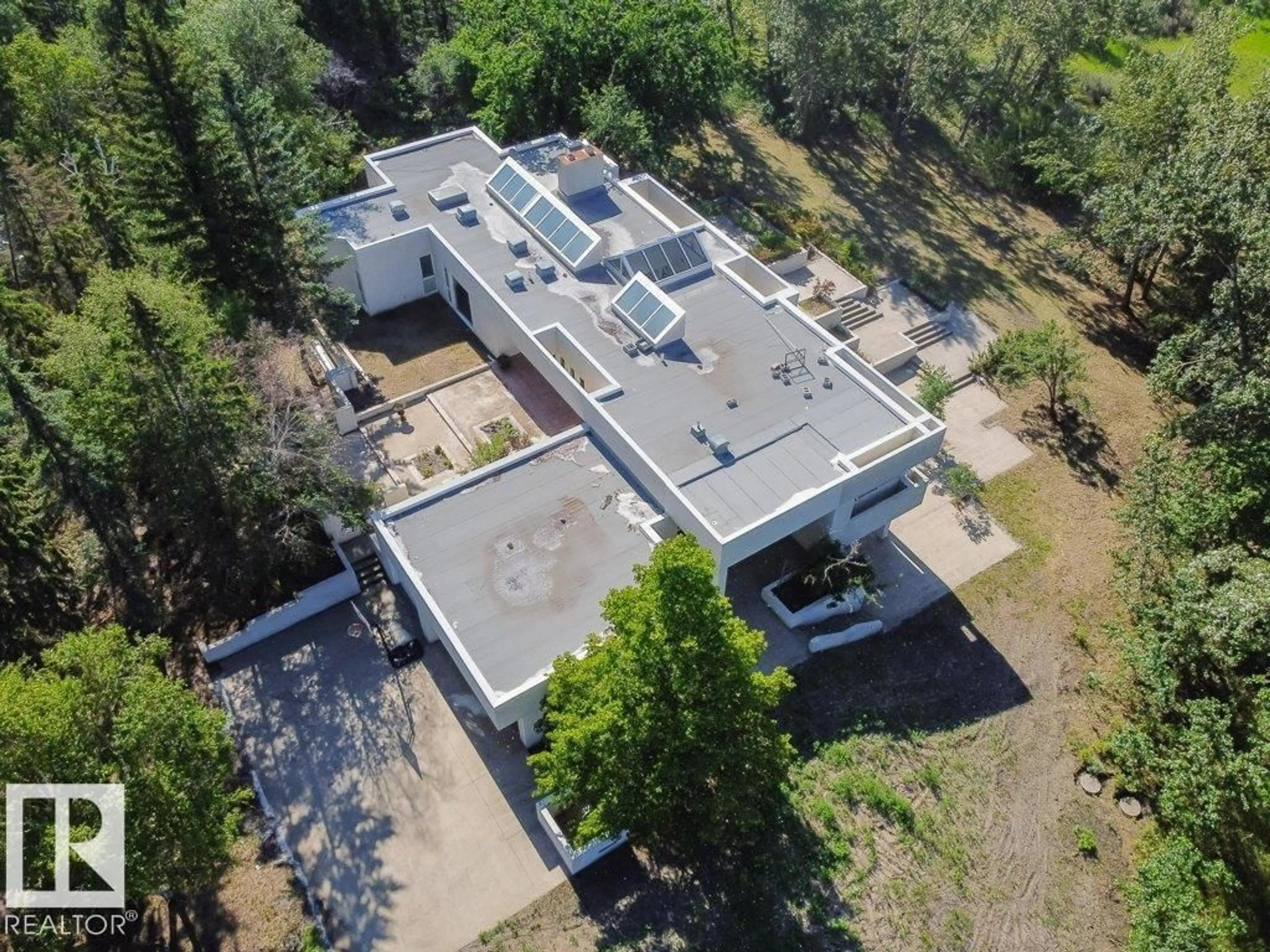 A pic from outside/outdoor area/front of a property/back of a property/a pic from drone, building for 3A - 51112 RGE RD 260, Rural Parkland County Alberta T7Y1B2