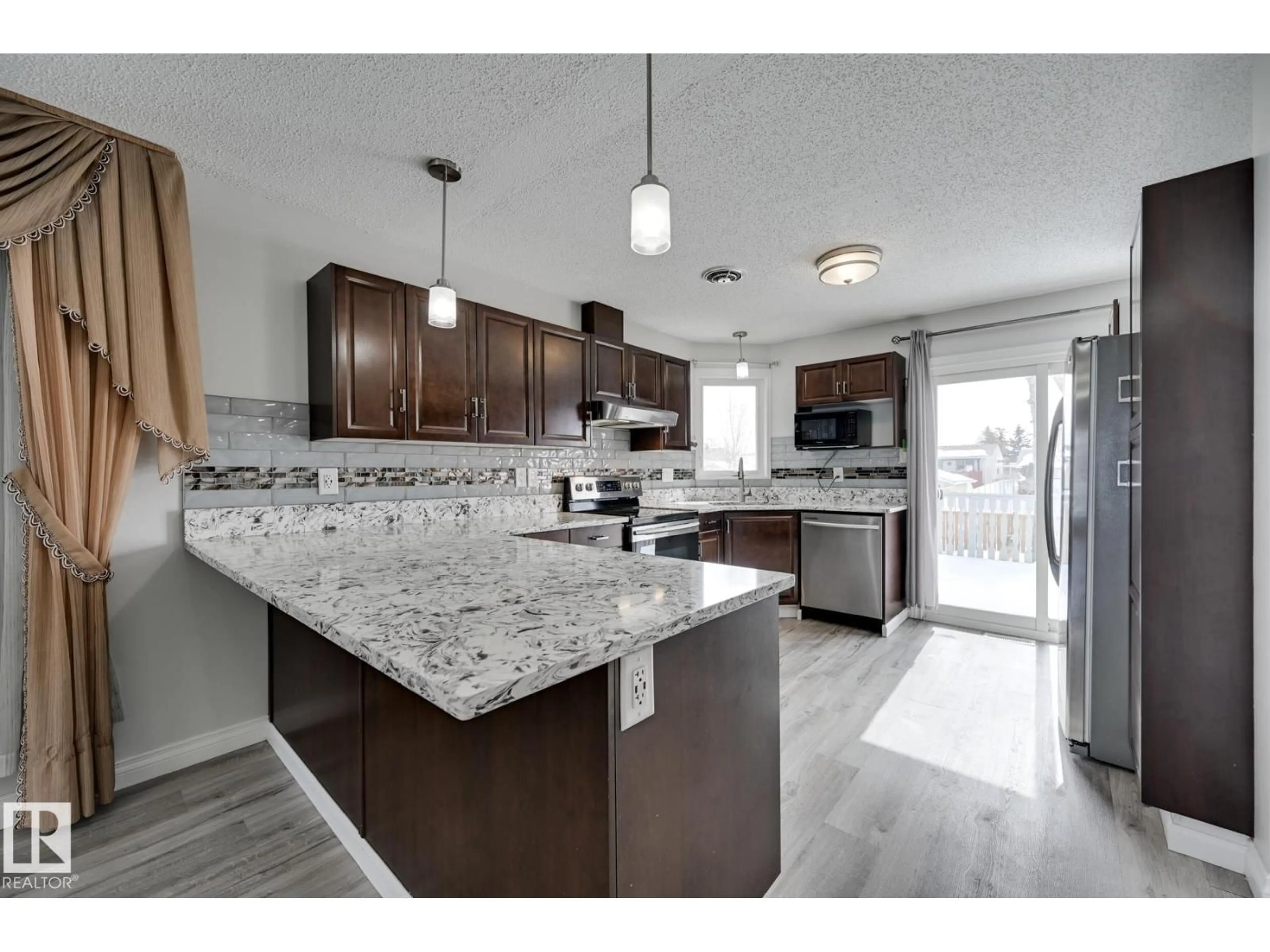Open concept kitchen, ceramic/tile floor for NW - 8507 152B AV, Edmonton Alberta T5E5V7