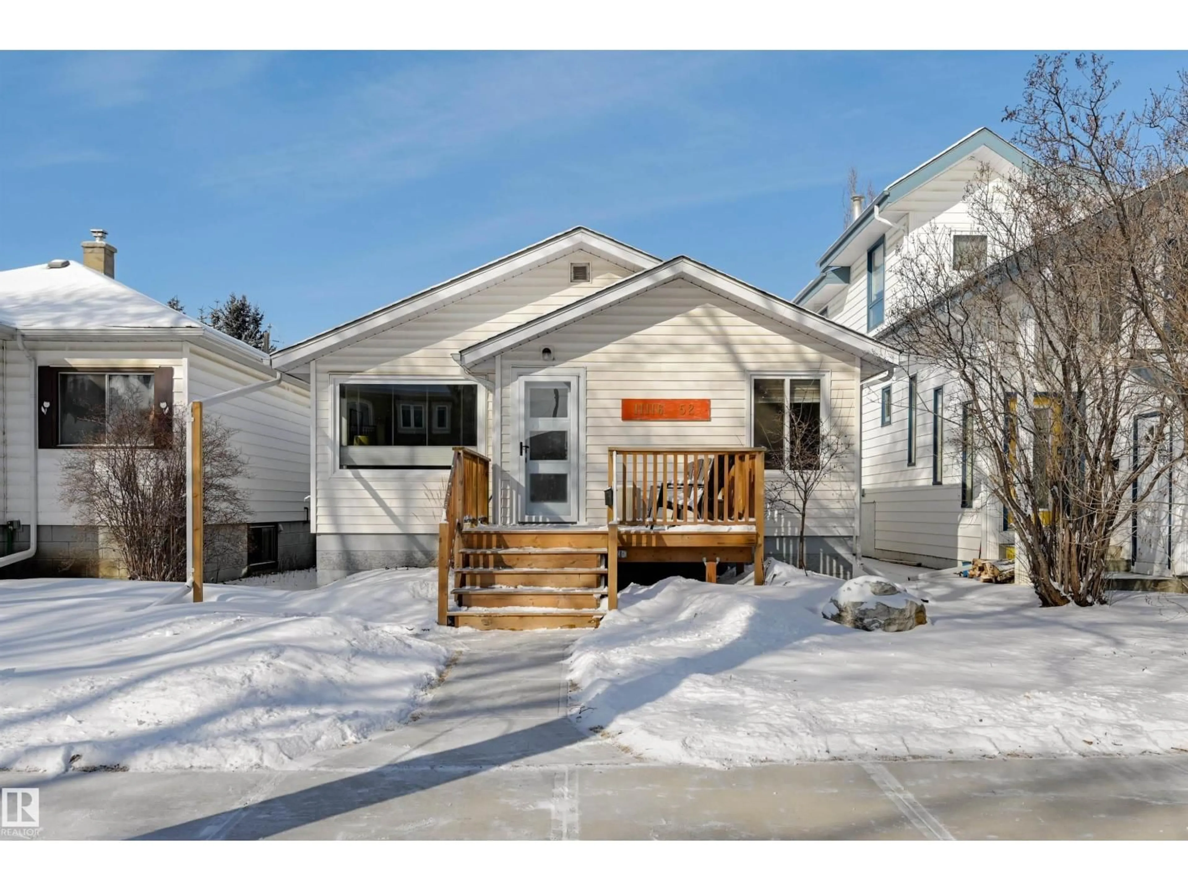 Home with vinyl exterior material, street for NW - 11116 52 ST, Edmonton Alberta T5W3H7