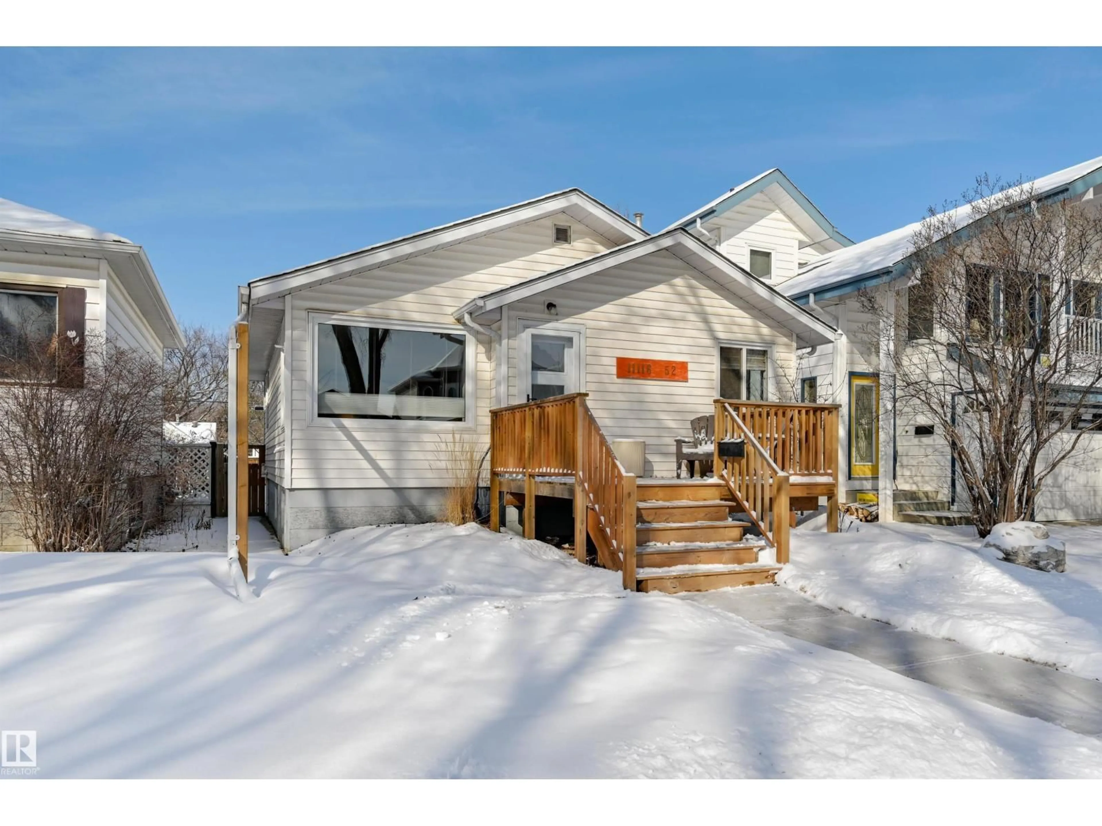 Home with vinyl exterior material, street for NW - 11116 52 ST, Edmonton Alberta T5W3H7