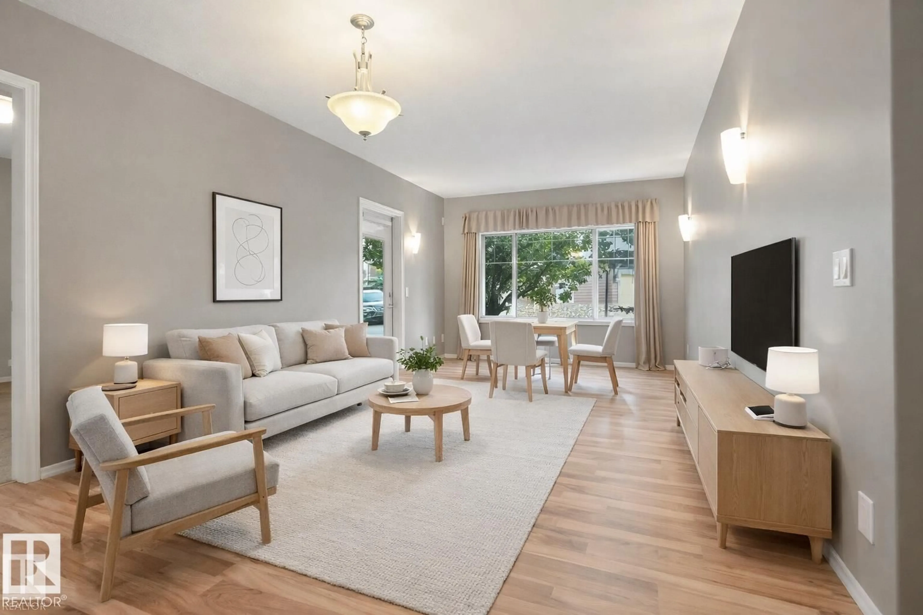 Living room with furniture, wood/laminate floor for #21 - 671 SILVER BERRY RD, Edmonton Alberta T6T0B7