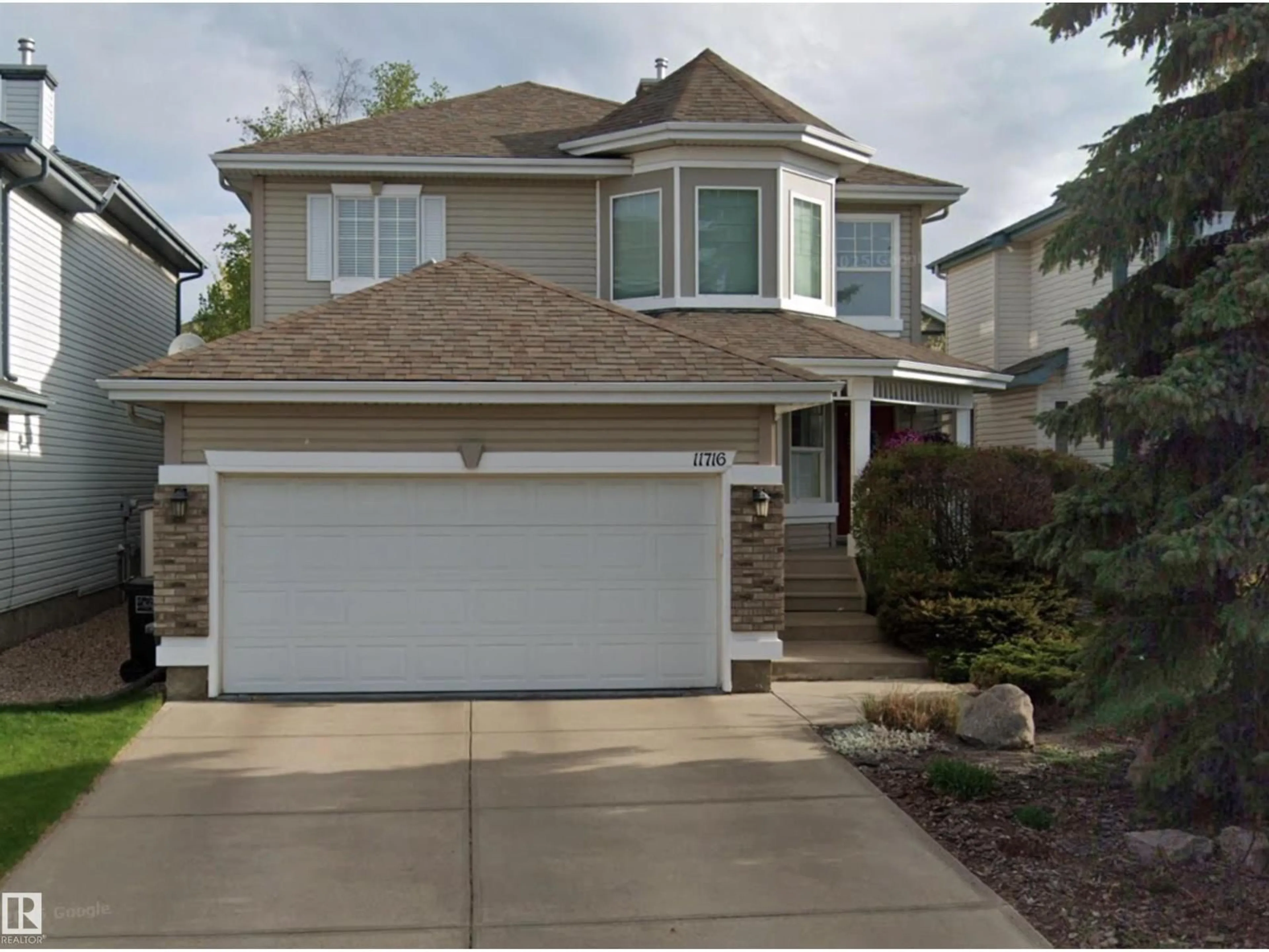 Home with vinyl exterior material, street for 11716 11A AV, Edmonton Alberta T6J7C4