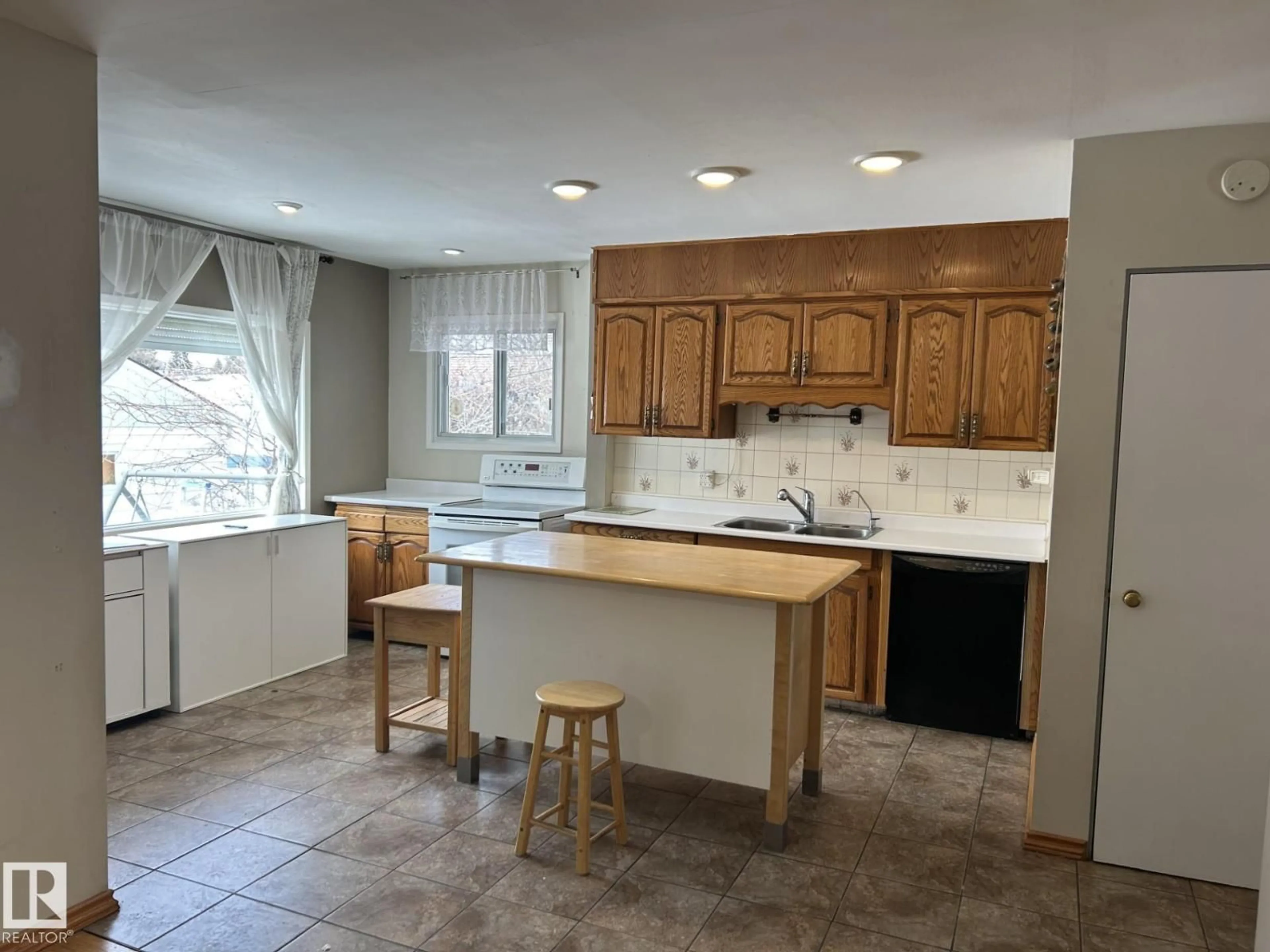 Open concept kitchen, ceramic/tile floor for 9128 83 ST, Edmonton Alberta T6W2A2