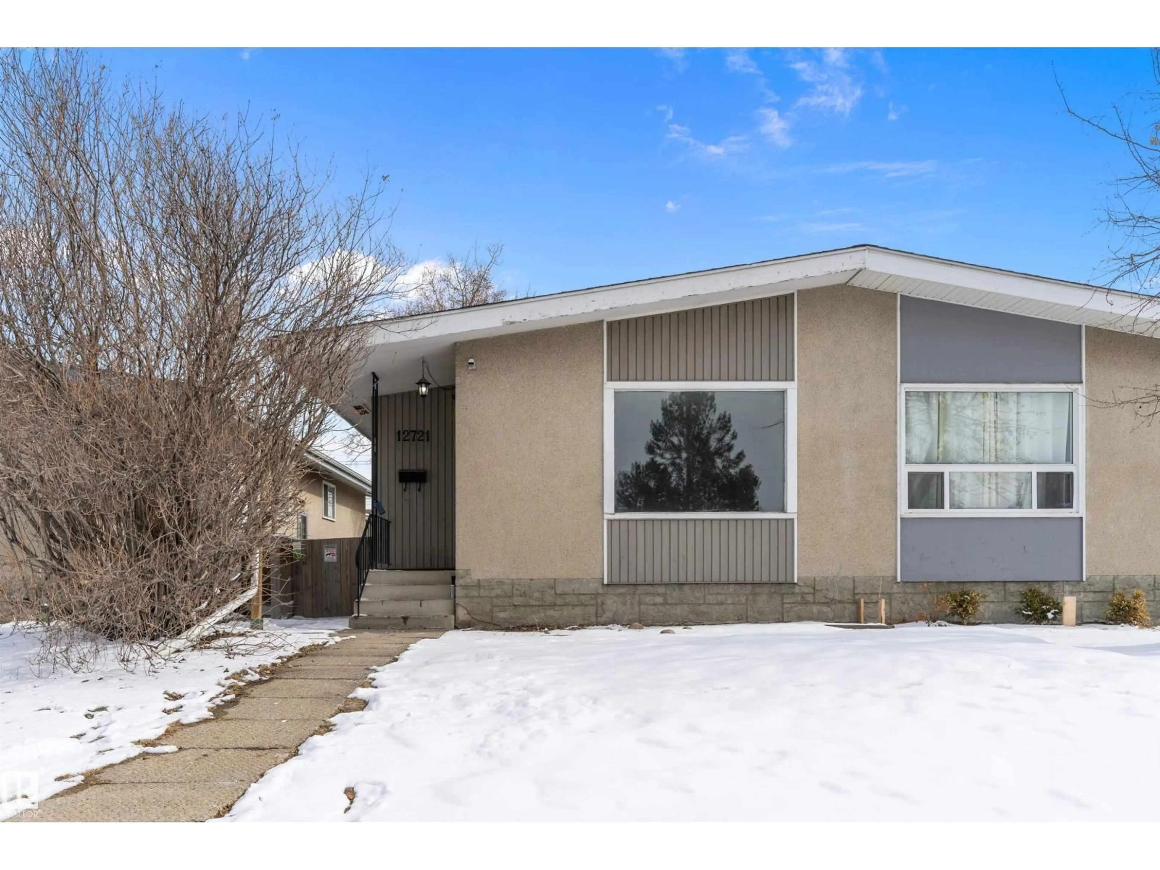 Home with vinyl exterior material, street for 12721 90 ST, Edmonton Alberta T5E3L5