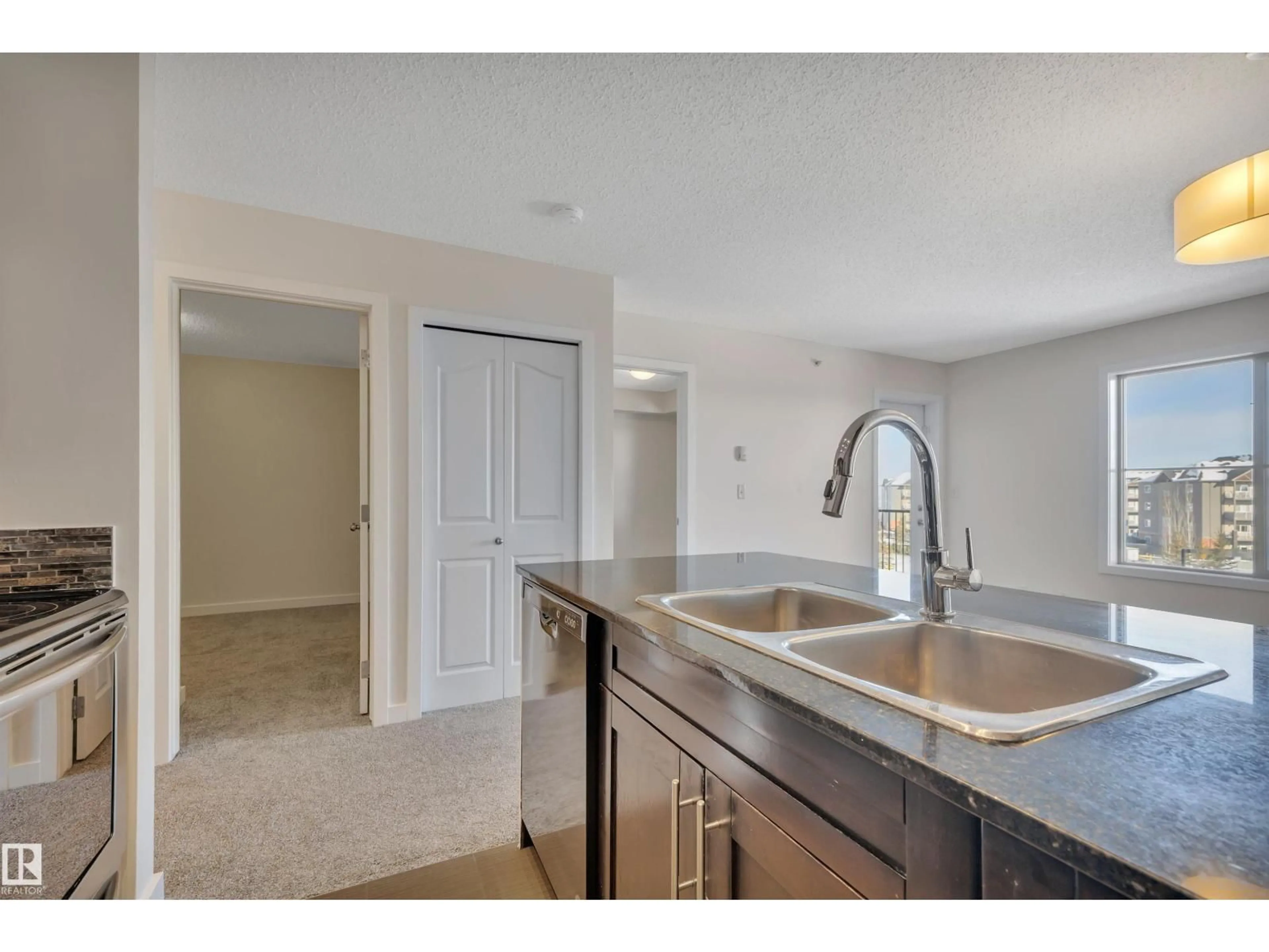 Open concept kitchen, unknown for #415 - 12035 22 AV, Edmonton Alberta T6W2X9