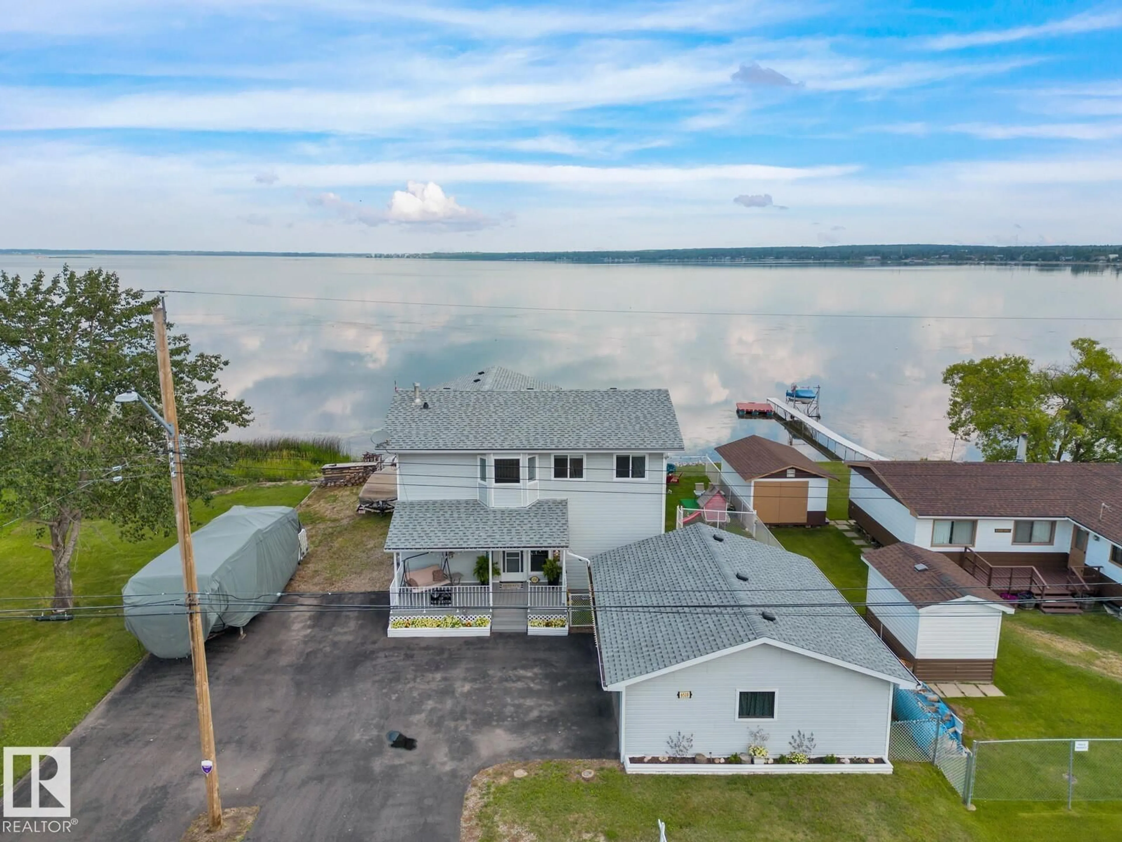 A pic from outside/outdoor area/front of a property/back of a property/a pic from drone, water/lake/river/ocean view for 6510 50 AVE, Rural Lac Ste. Anne County Alberta T0E0A0