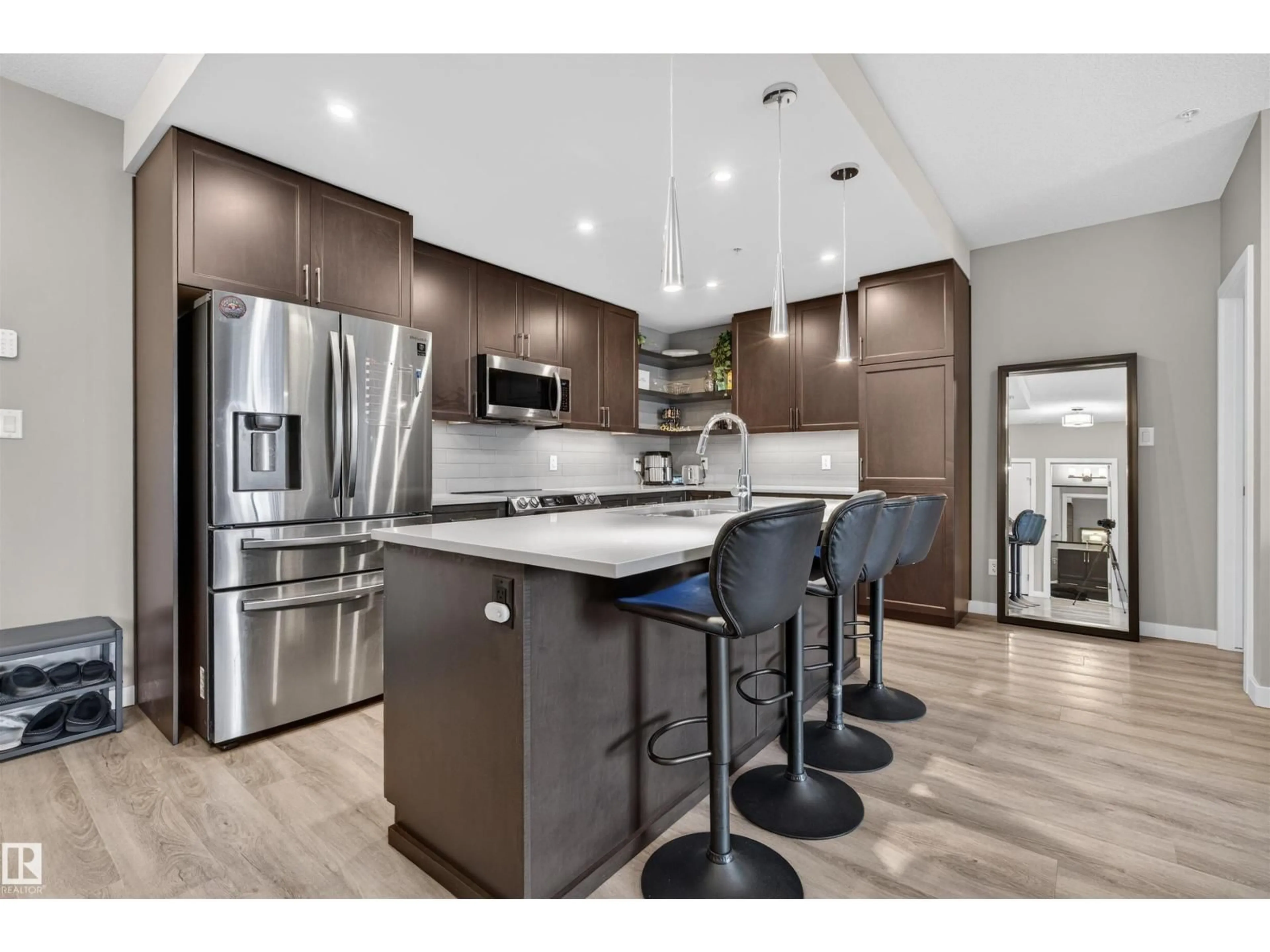 Open concept kitchen, wood/laminate floor for #238 - 1154 ADAMSON DR, Edmonton Alberta T6W3N5
