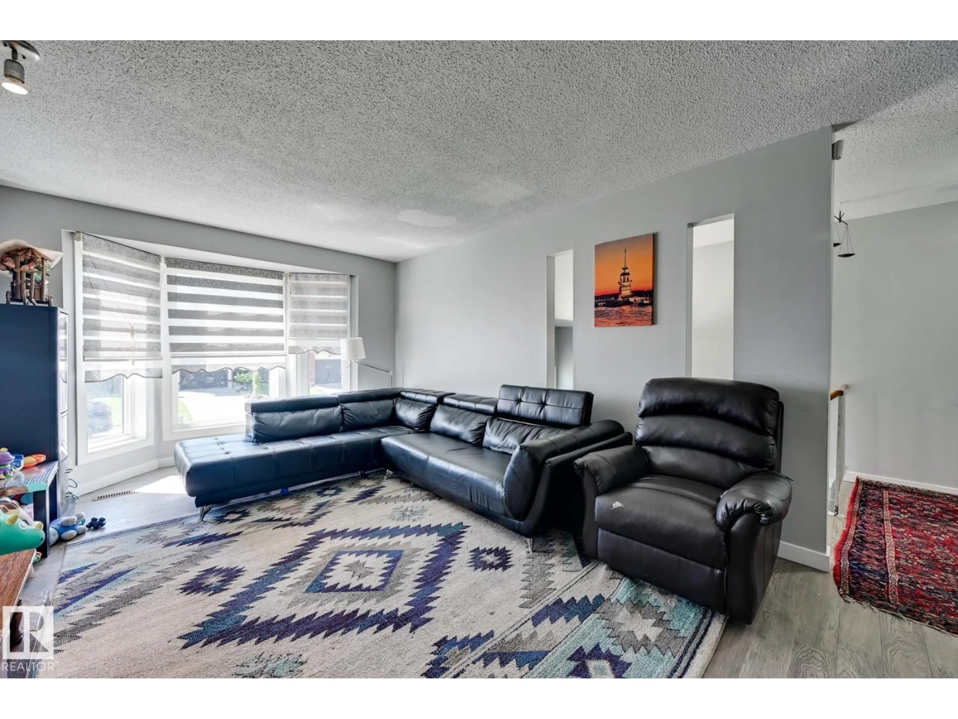 Living room with furniture, carpet floor for 4628 37 AV, Edmonton Alberta T6L3V1