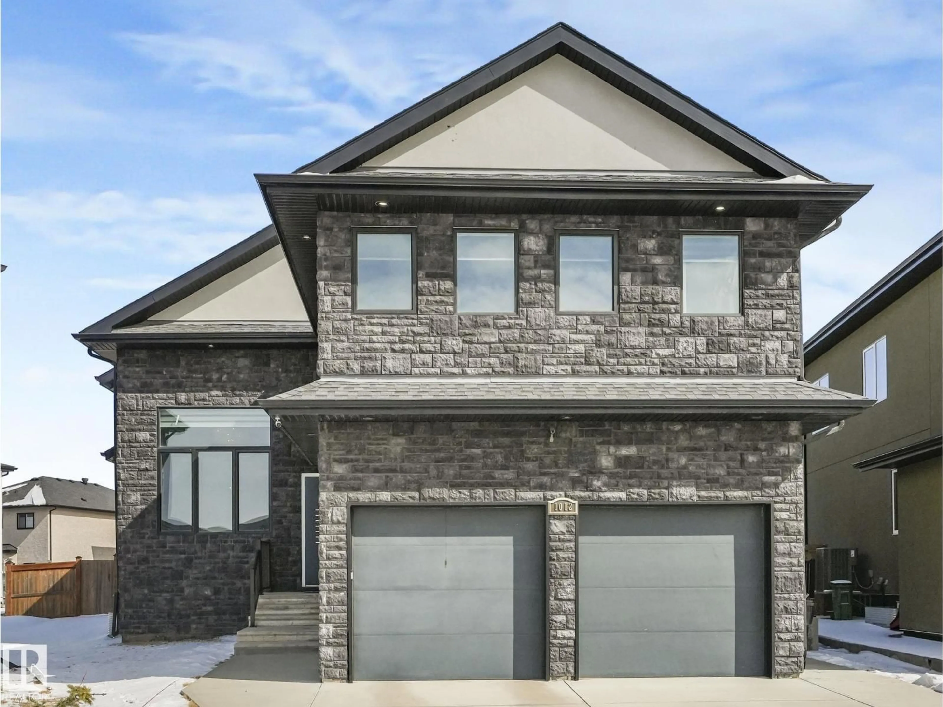 Home with brick exterior material, street for 1012 148 AV, Edmonton Alberta T5Y0V4