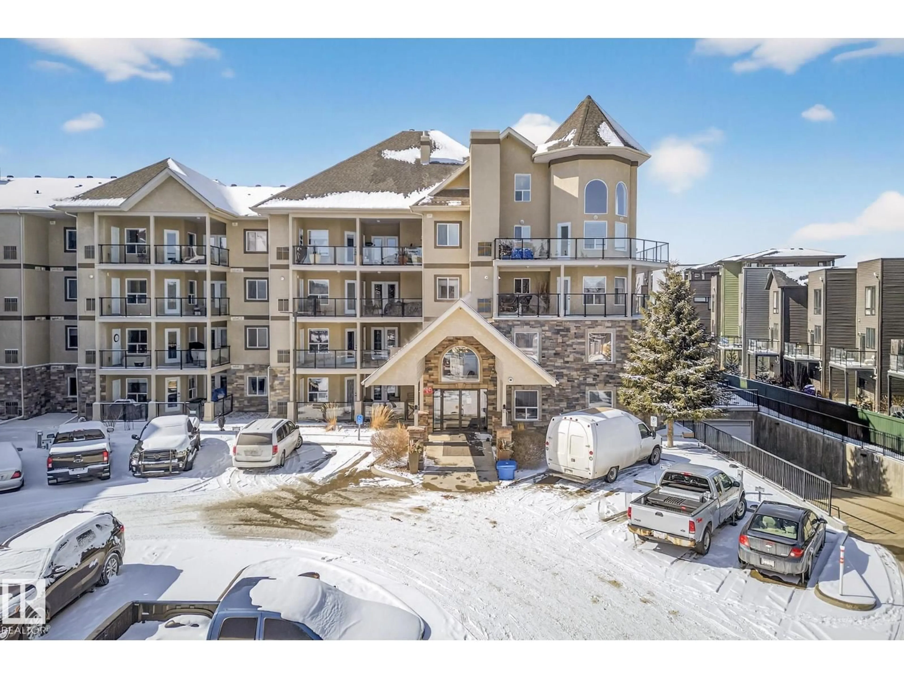 A pic from outside/outdoor area/front of a property/back of a property/a pic from drone, mountain view for #411 - 1320 RUTHERFORD RD, Edmonton Alberta T6W0B6