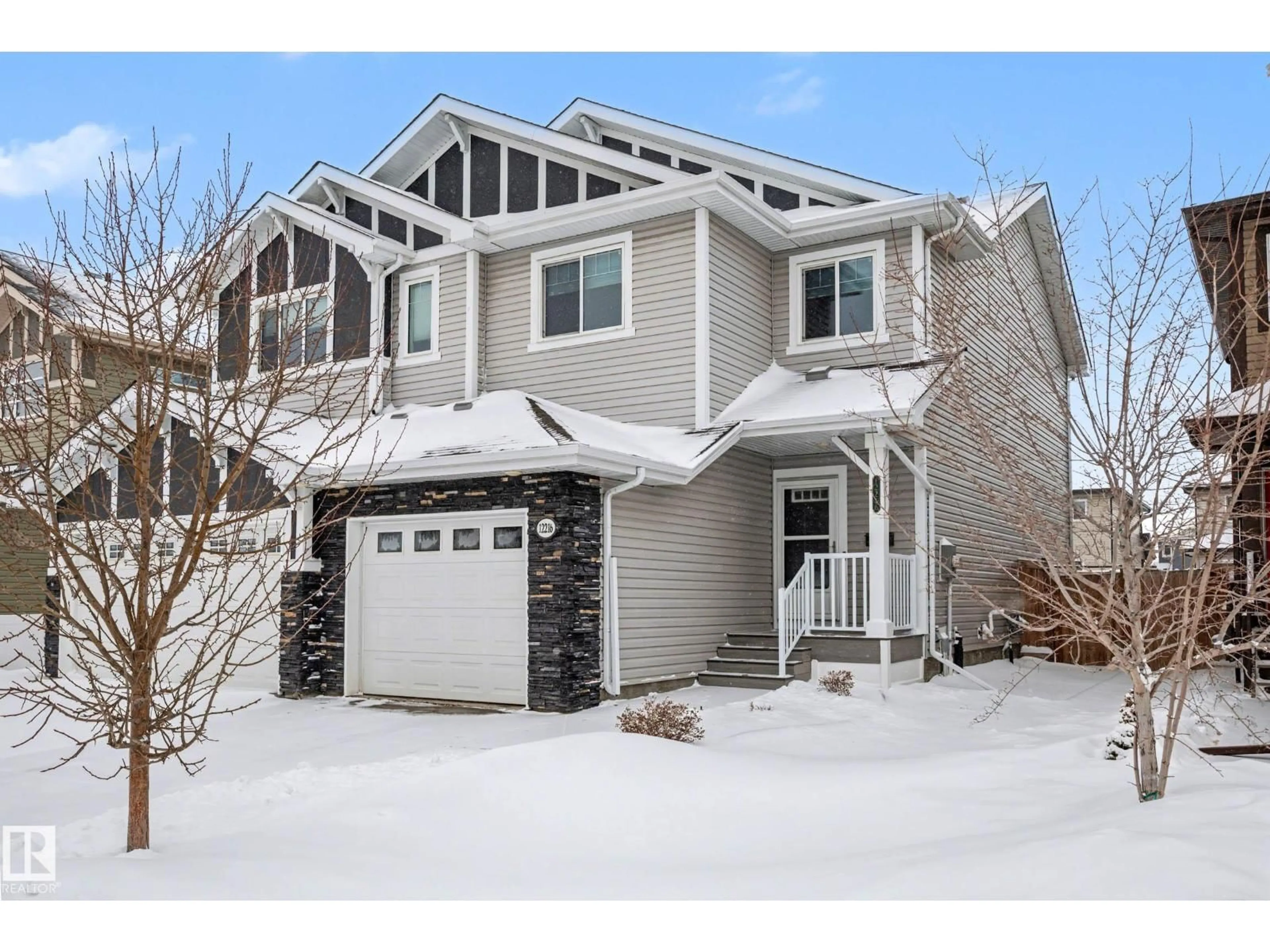 Home with vinyl exterior material, street for NW - 12216 176 AV, Edmonton Alberta T5Y0L2