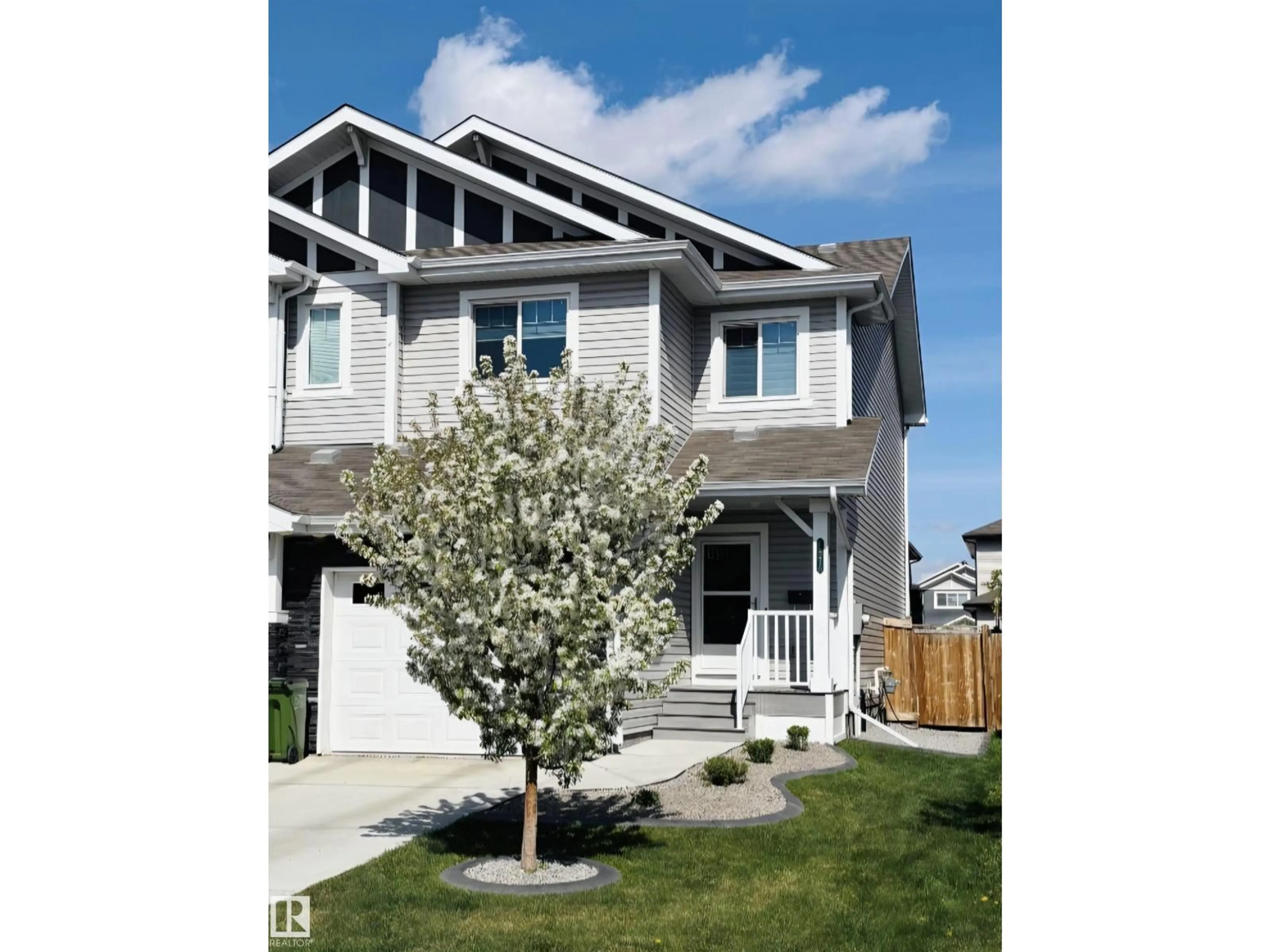 Home with vinyl exterior material, street for NW - 12216 176 AV, Edmonton Alberta T5Y0L2