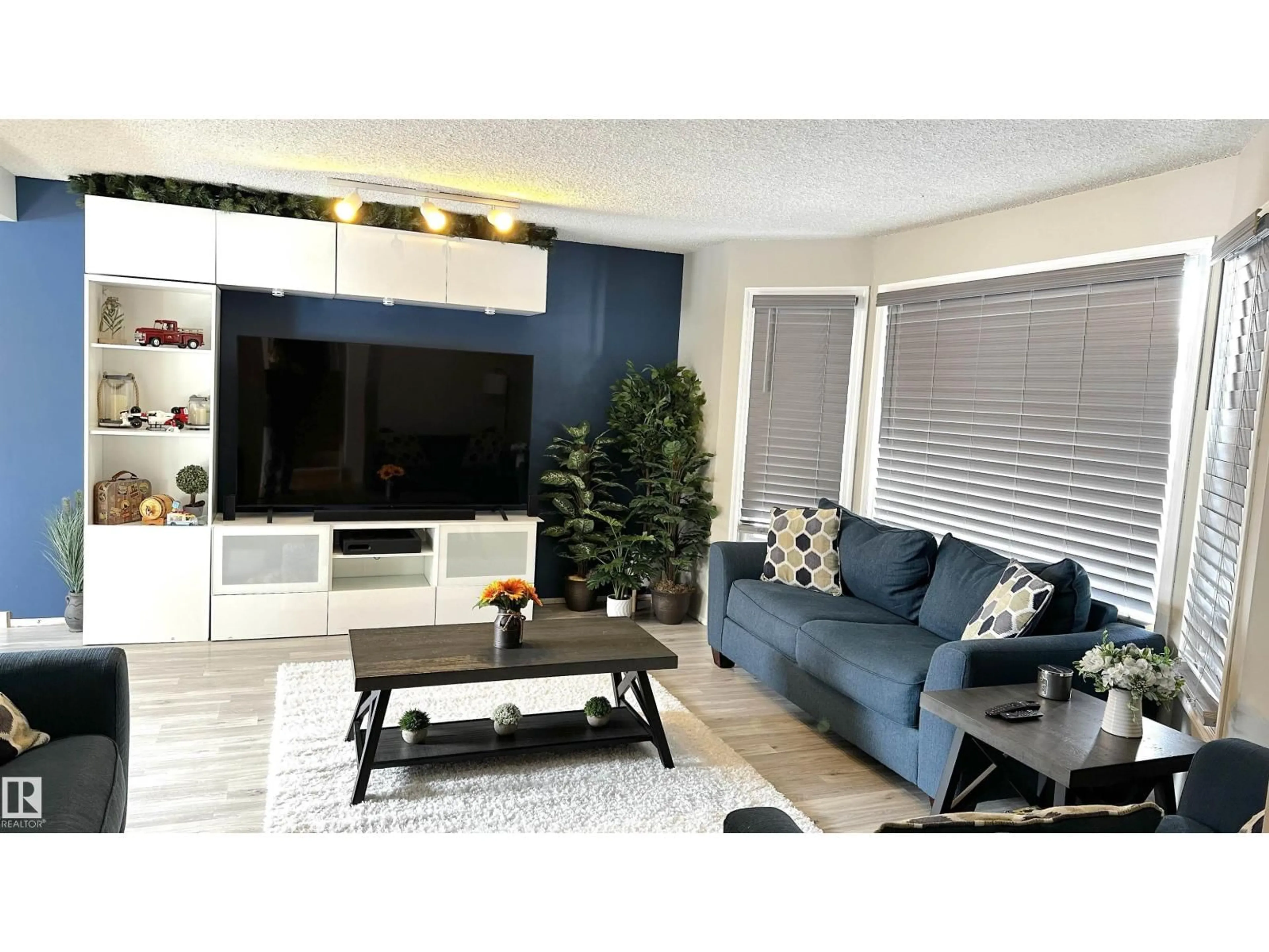 Living room with furniture, wood/laminate floor for 224 GAINSBORO CT, Sherwood Park Alberta T8A2J3