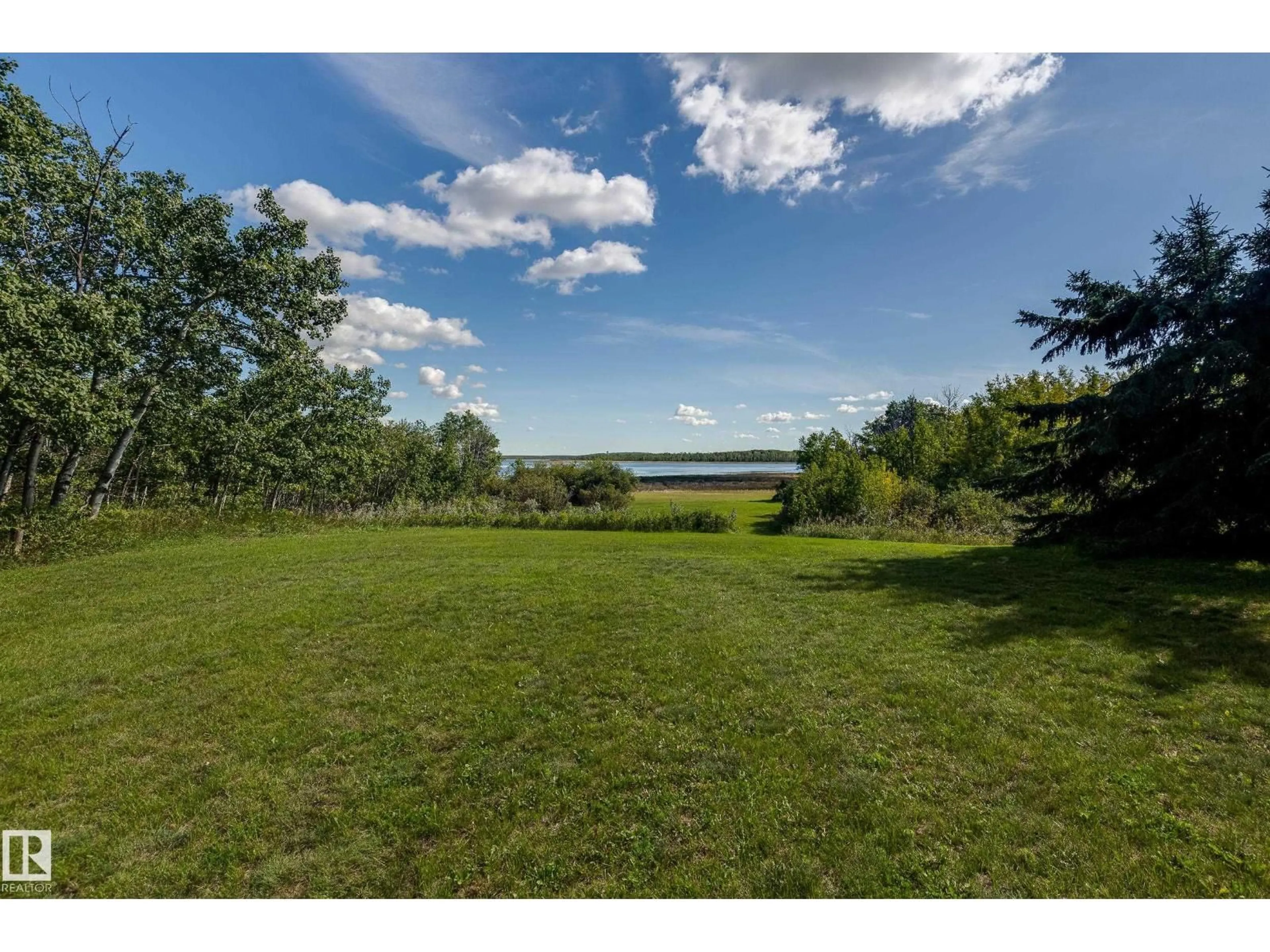 A pic from outside/outdoor area/front of a property/back of a property/a pic from drone, water/lake/river/ocean view for 602 PHEASANT CL, Rural Camrose County Alberta T0B0H0
