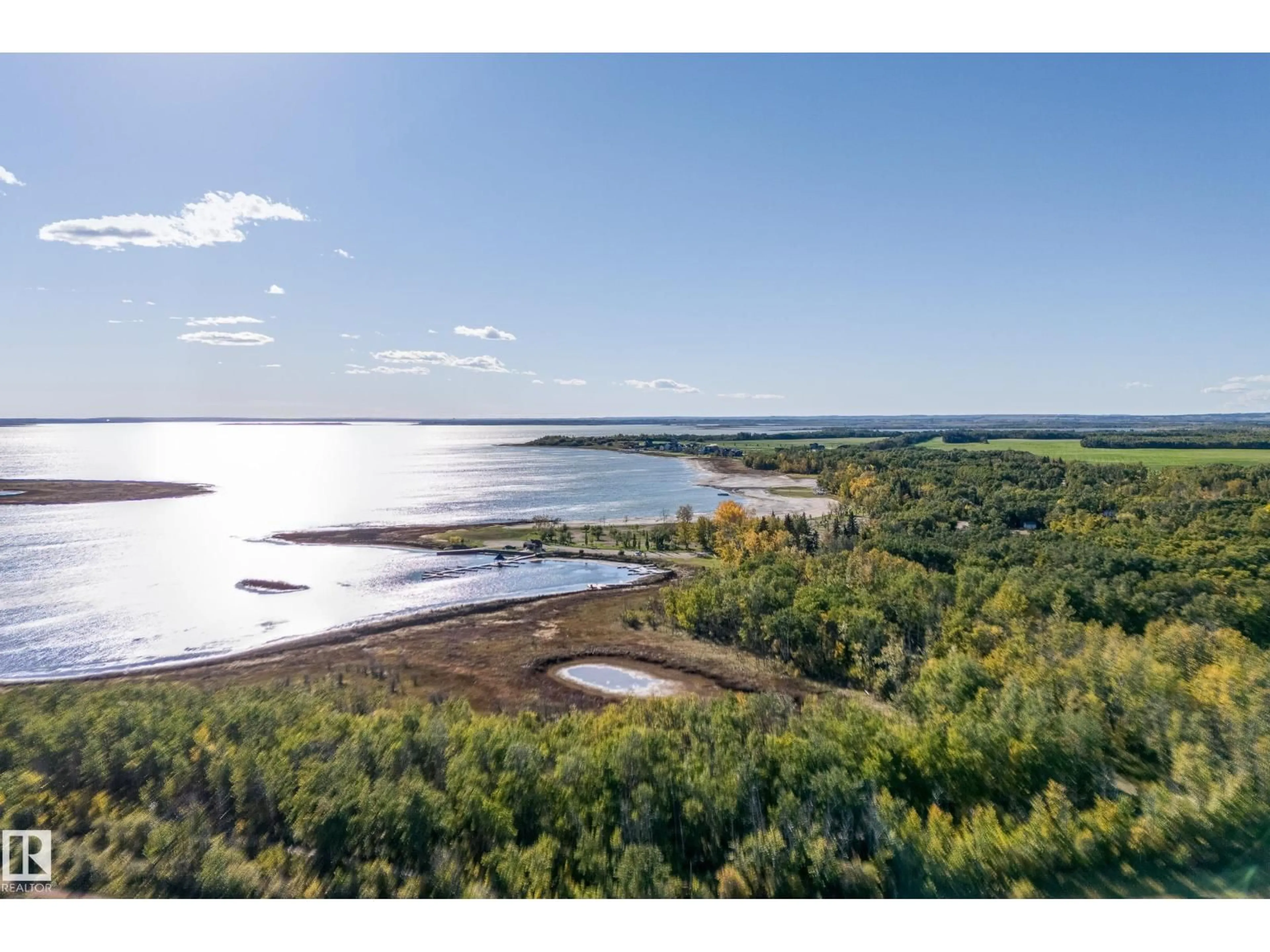 A pic from outside/outdoor area/front of a property/back of a property/a pic from drone, water/lake/river/ocean view for 602 PHEASANT CL, Rural Camrose County Alberta T0B0H0