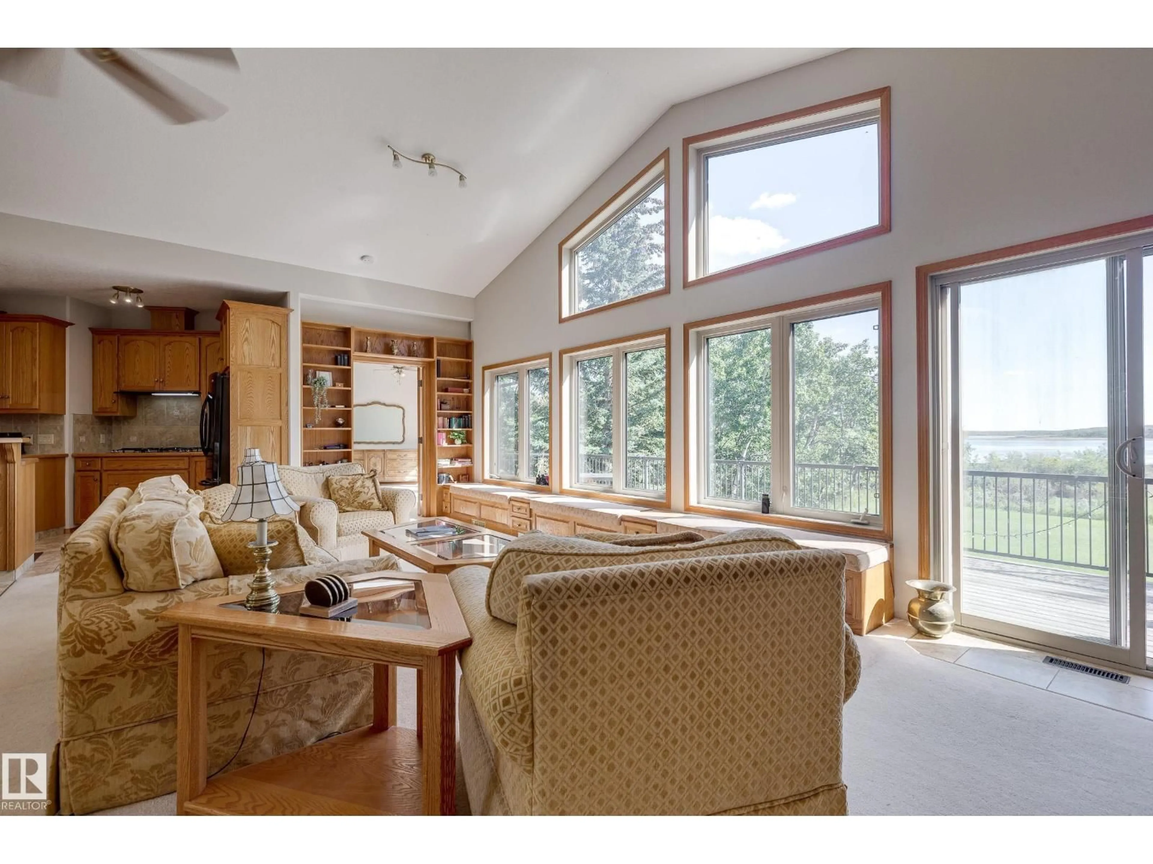 Living room with furniture, wood/laminate floor for 602 PHEASANT CL, Rural Camrose County Alberta T0B0H0