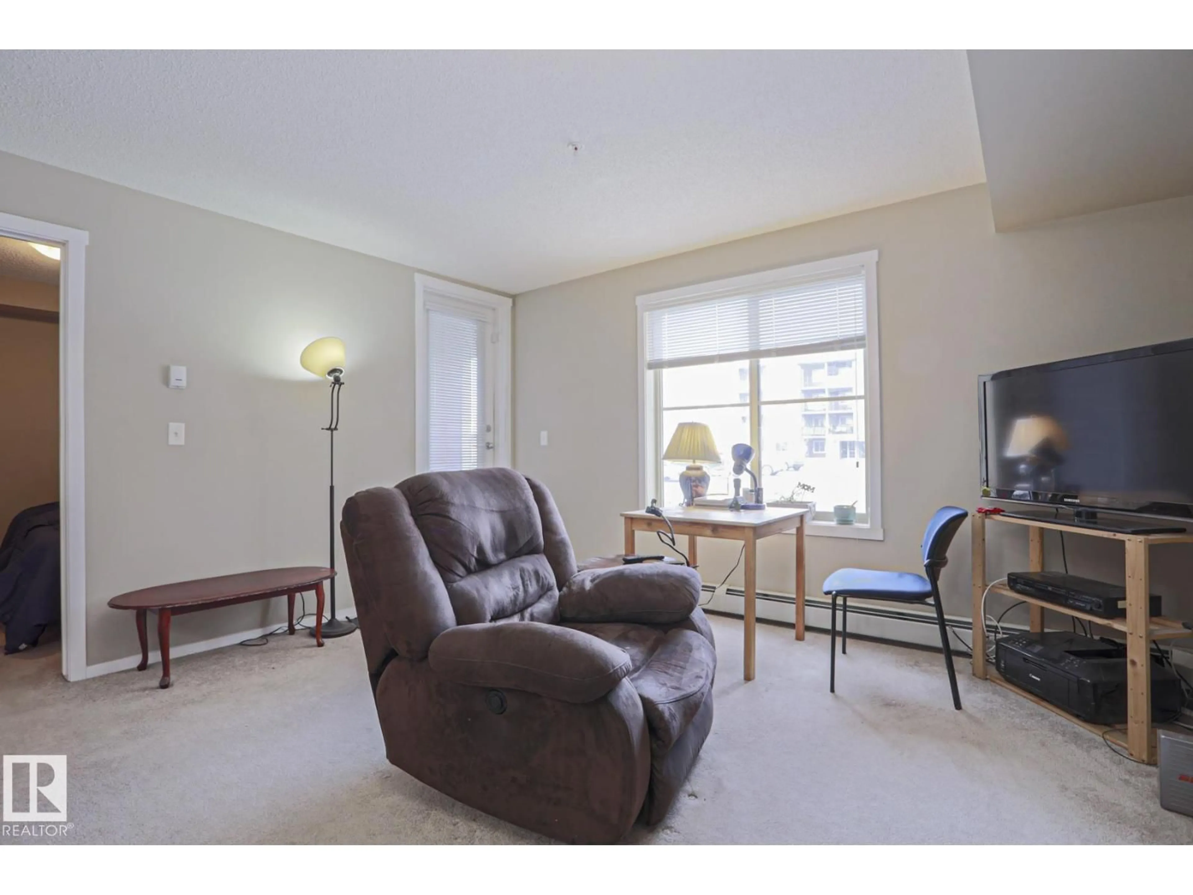 Living room with furniture, unknown for 3207 - 110 JAMES MOWATT TR, Edmonton Alberta T6W3L6