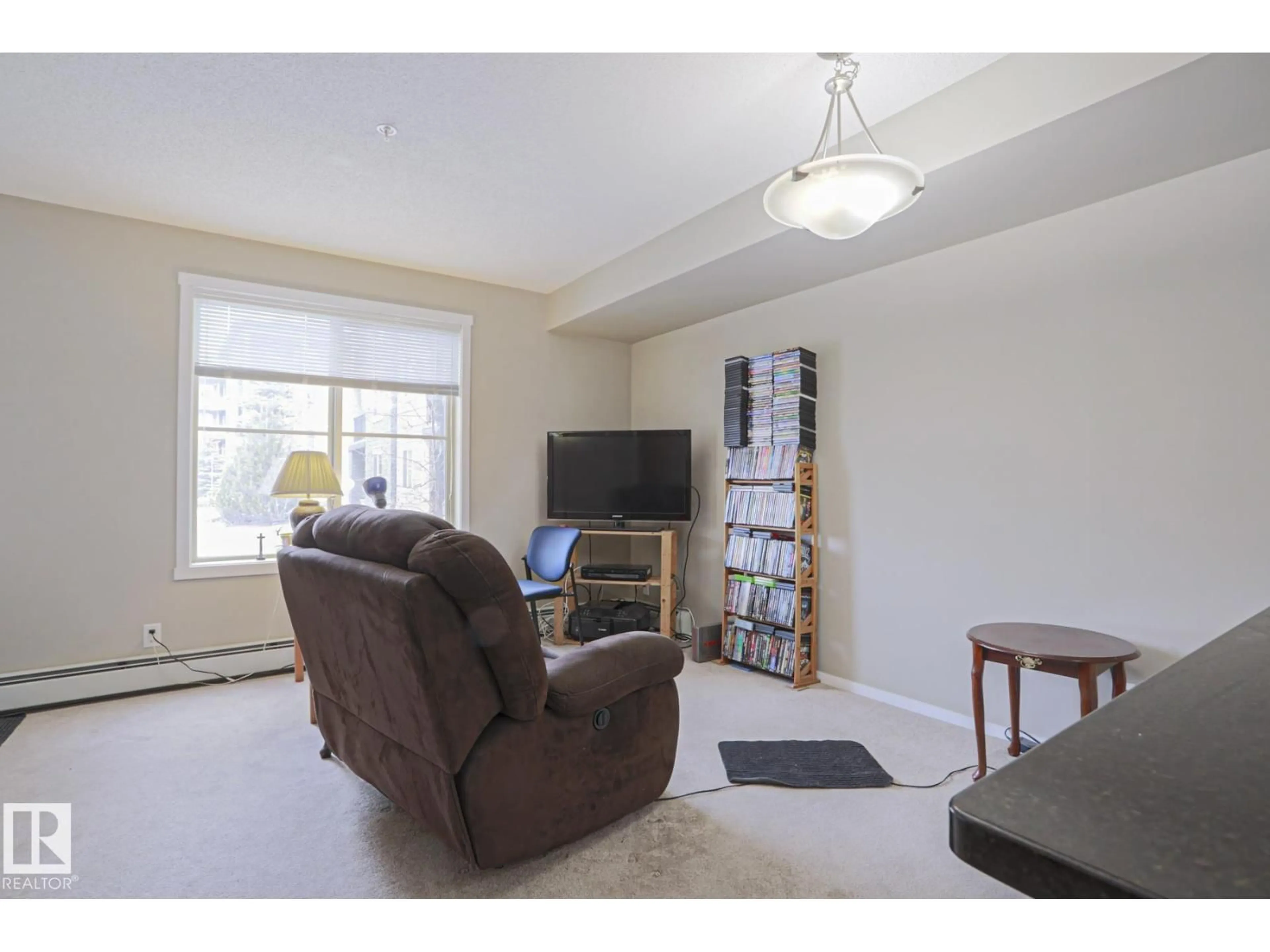 Living room with furniture, unknown for 3207 - 110 JAMES MOWATT TR, Edmonton Alberta T6W3L6