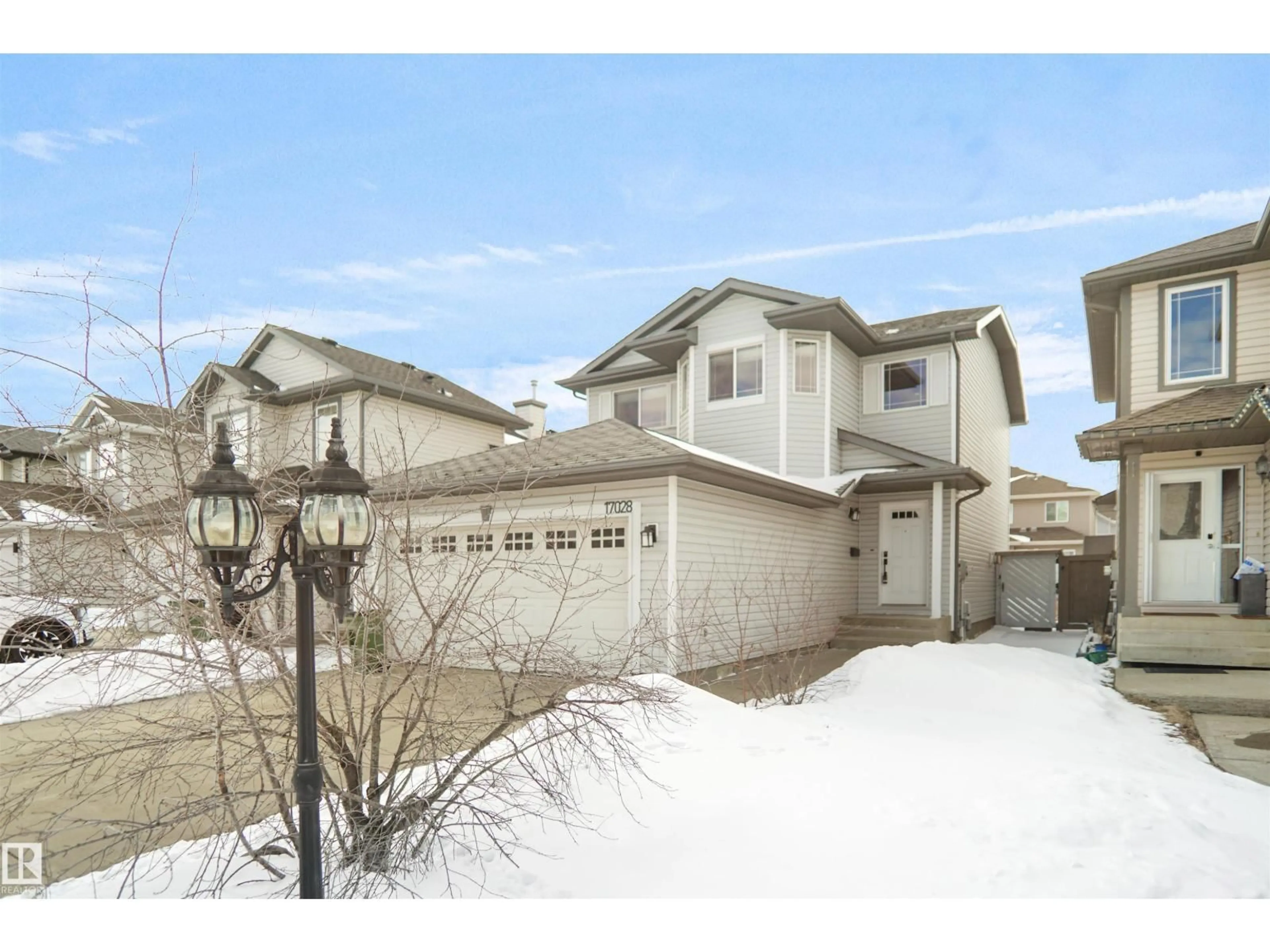 Home with vinyl exterior material, street for NW - 17028 119 ST, Edmonton Alberta T5X6H8