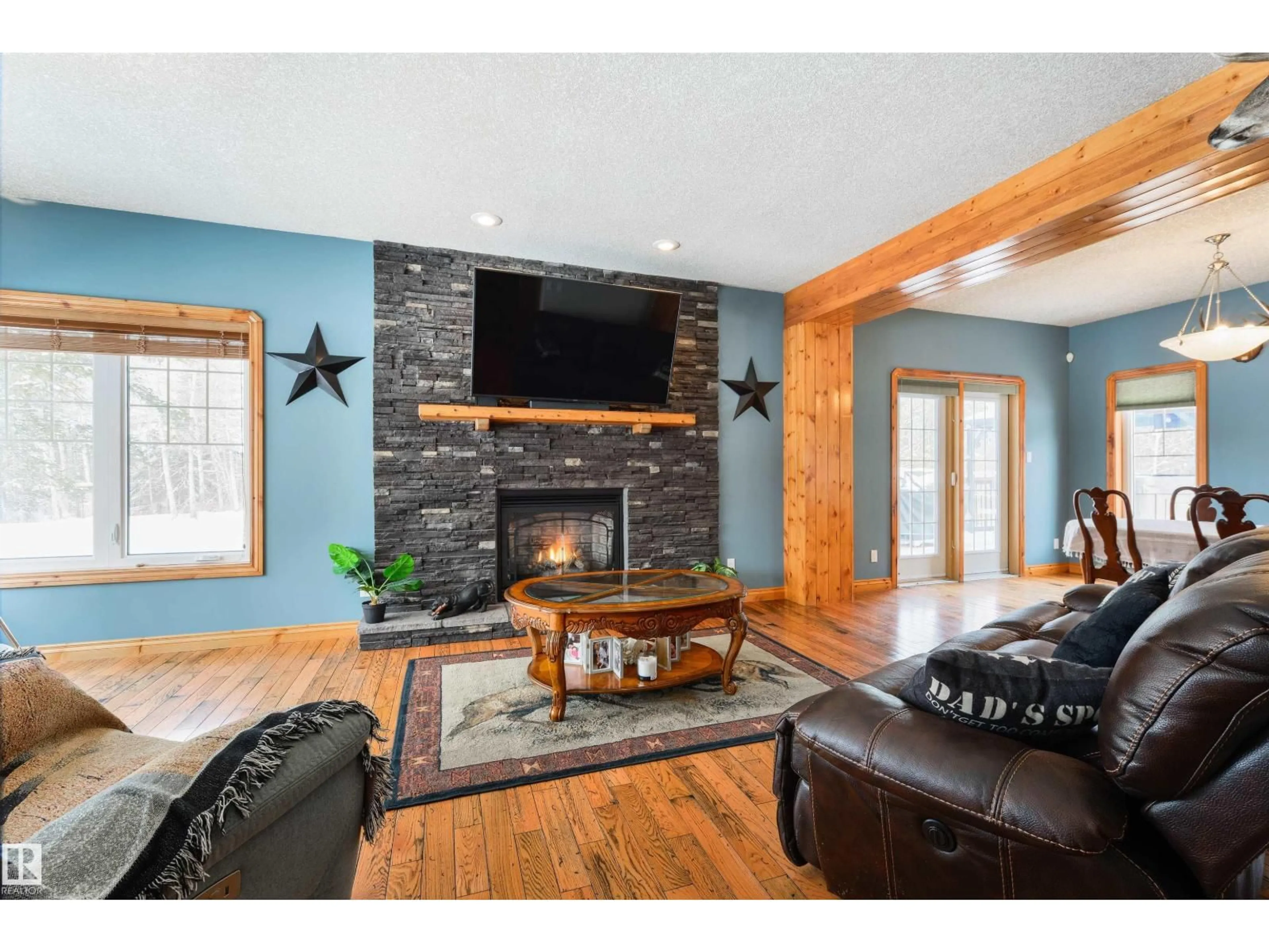Living room with furniture, wood/laminate floor for 50529 - 171 RGE ROAD 21, Rural Parkland County Alberta T7Y2N4
