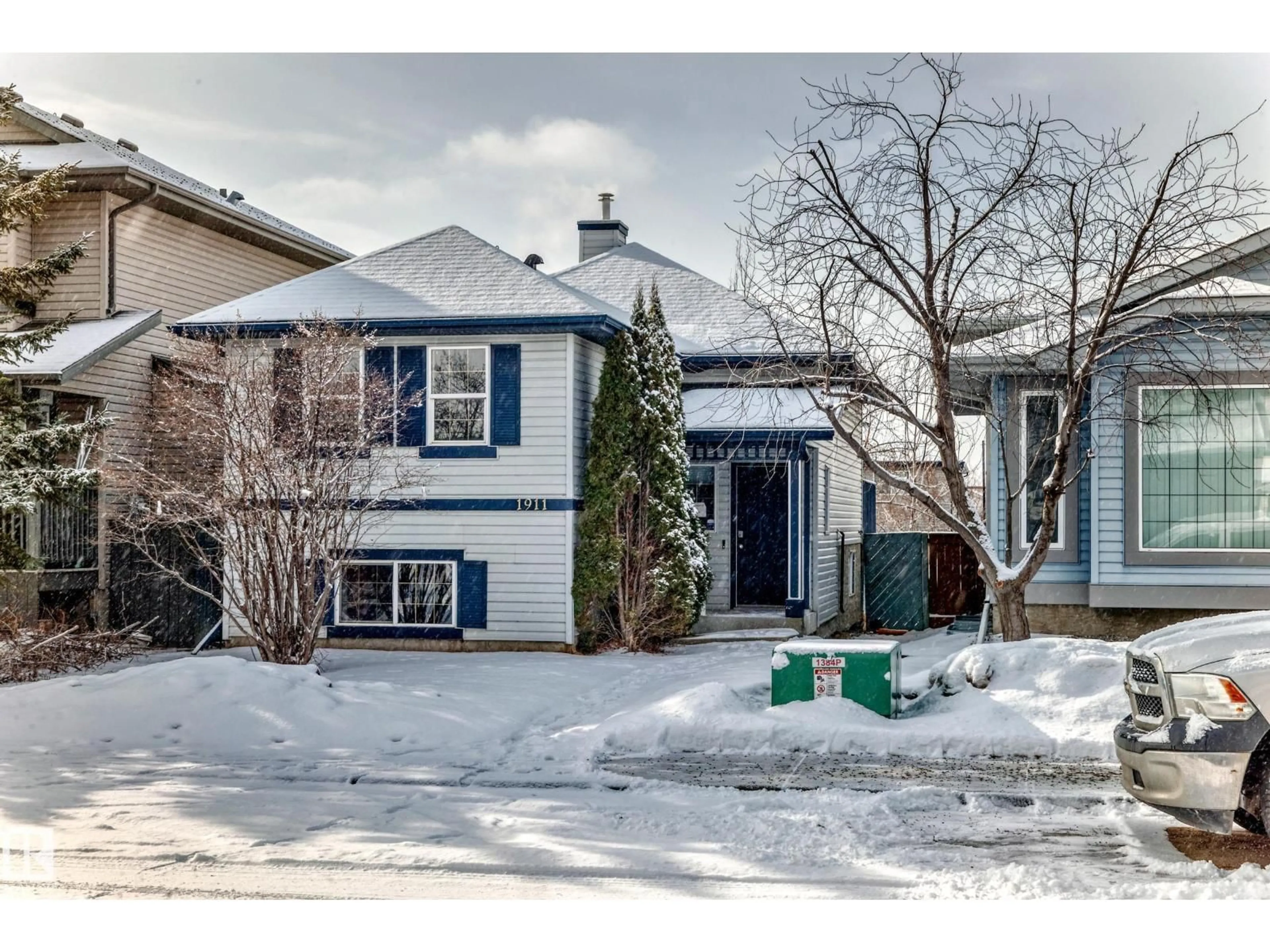 Home with vinyl exterior material, street for 1911 36 AV, Edmonton Alberta T6T1S9