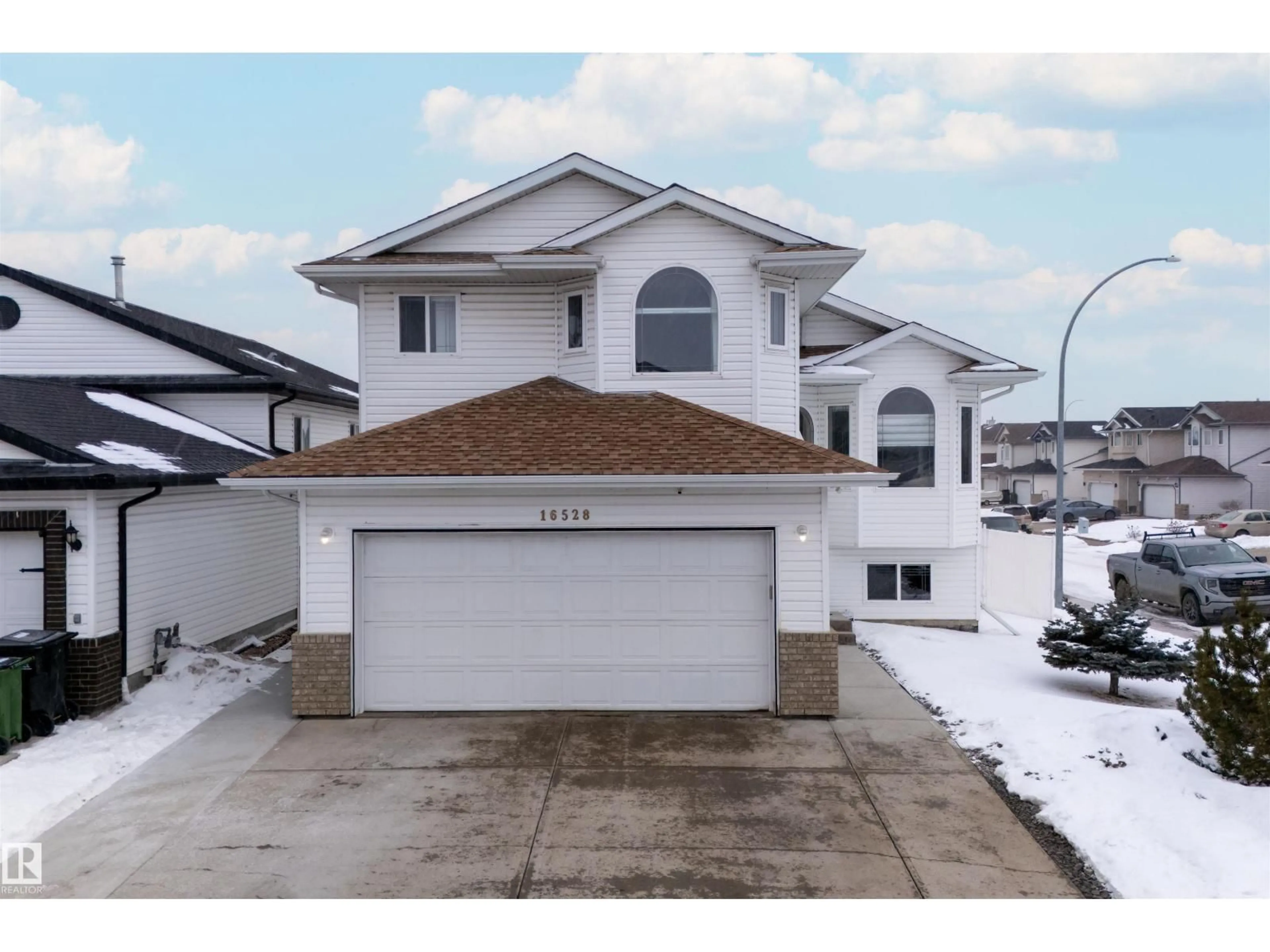 Home with vinyl exterior material, street for NW - 16528 68 ST, Edmonton Alberta T5Z3T2