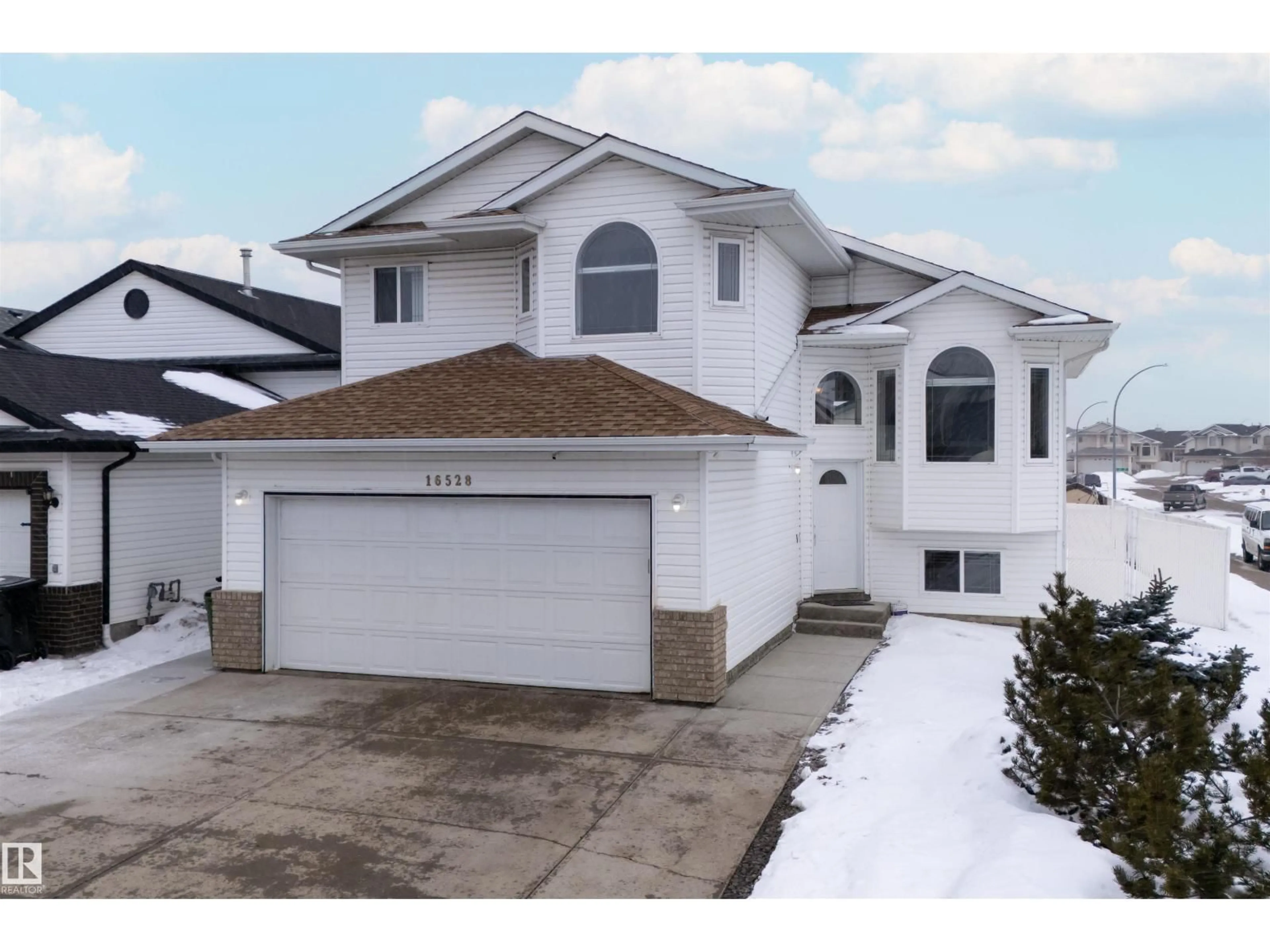 Home with vinyl exterior material, street for NW - 16528 68 ST, Edmonton Alberta T5Z3T2