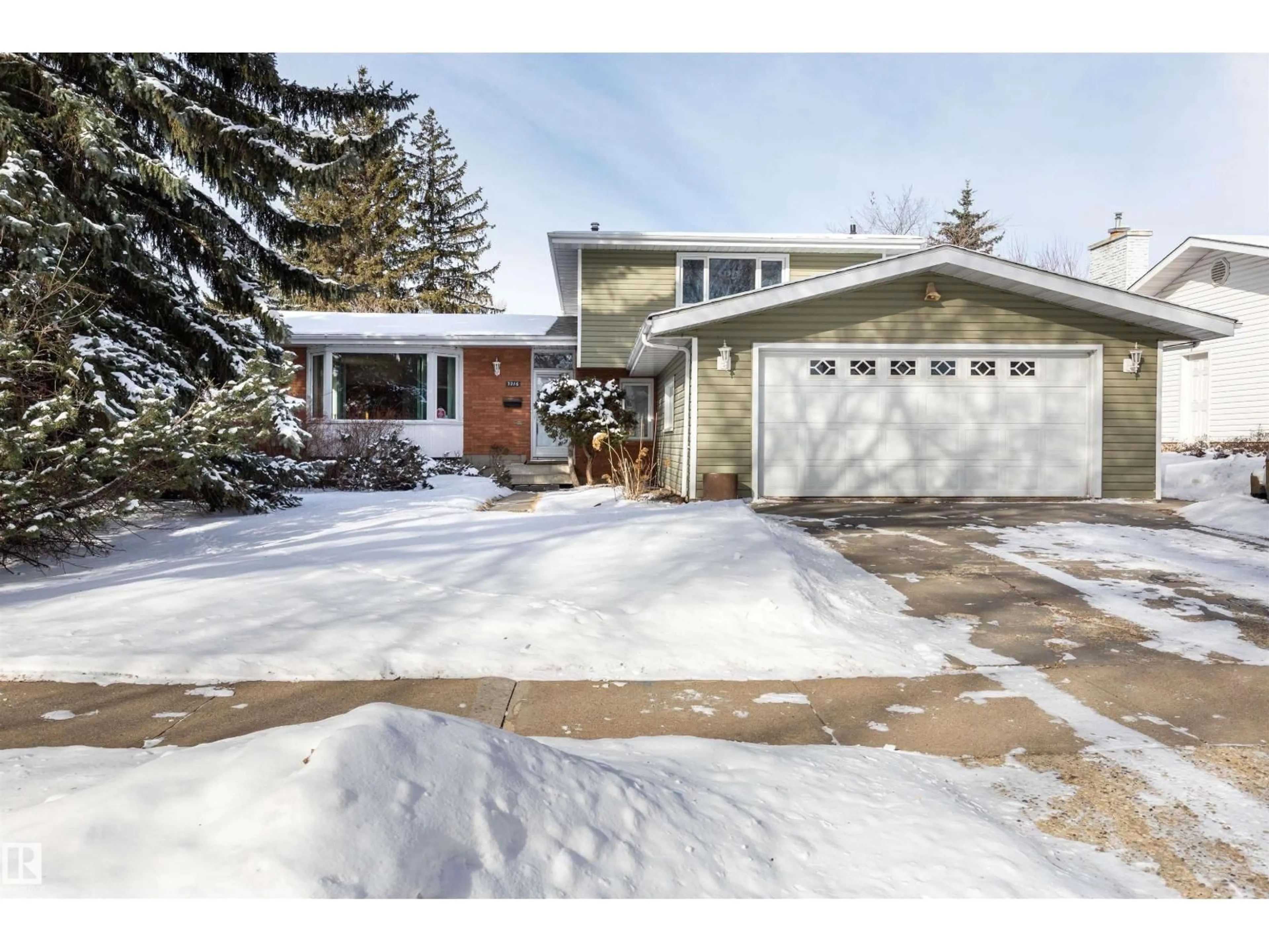 Home with vinyl exterior material, street for NW - 7716 157 ST, Edmonton Alberta T5R2A2