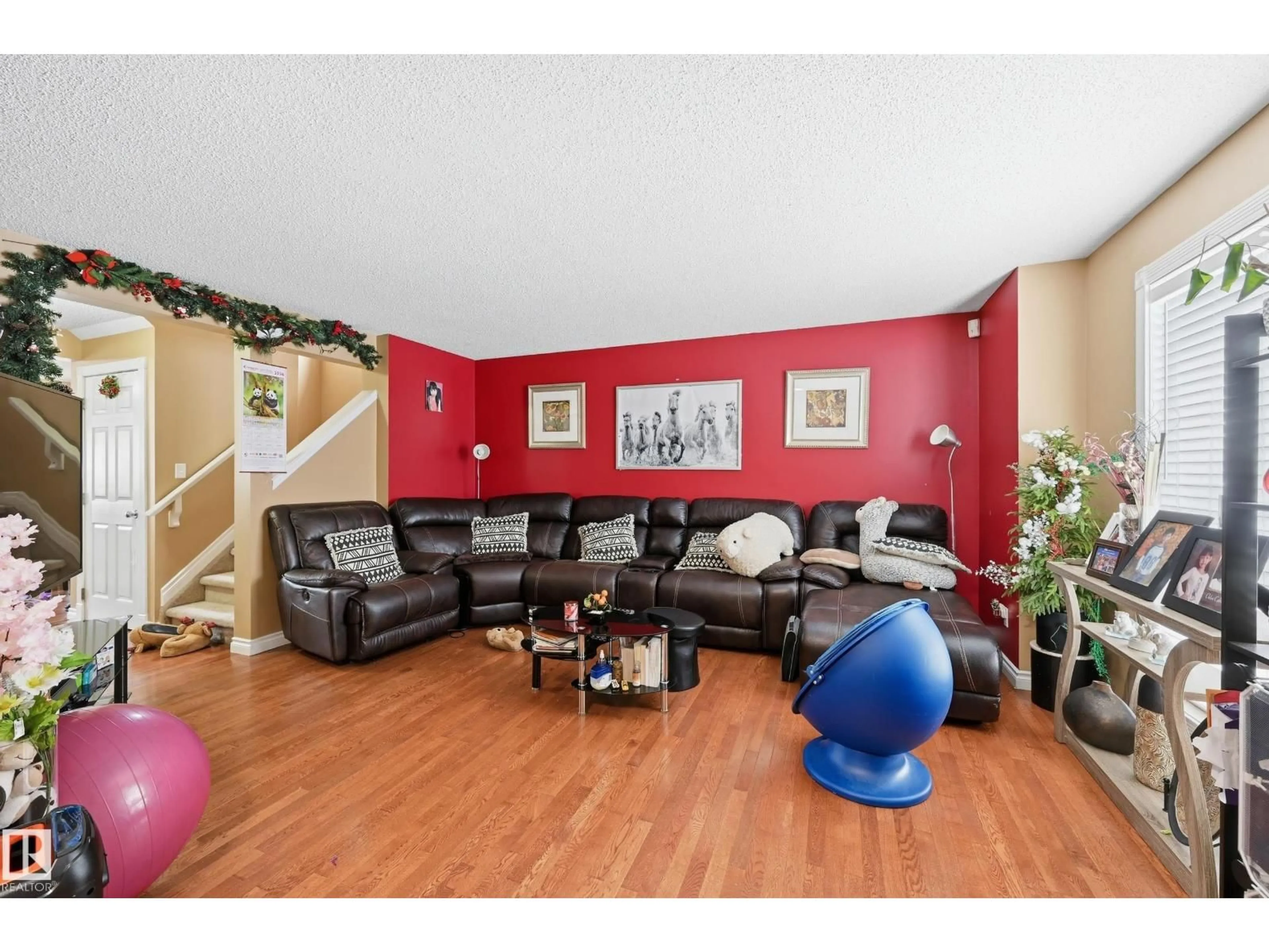 Living room with furniture, wood/laminate floor for NW - 3010 32 AV, Edmonton Alberta T6T1X1