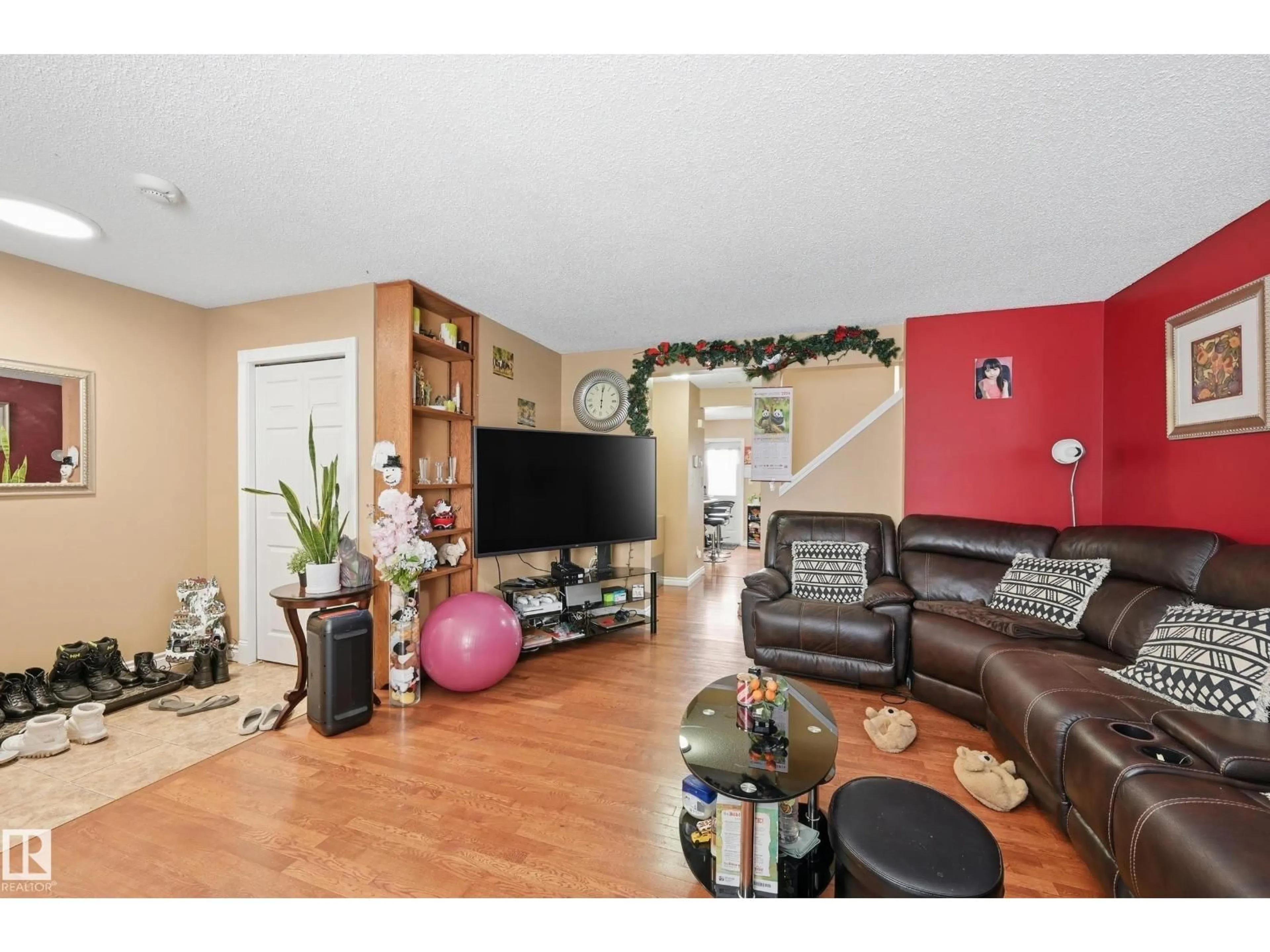 Living room with furniture, wood/laminate floor for NW - 3010 32 AV, Edmonton Alberta T6T1X1