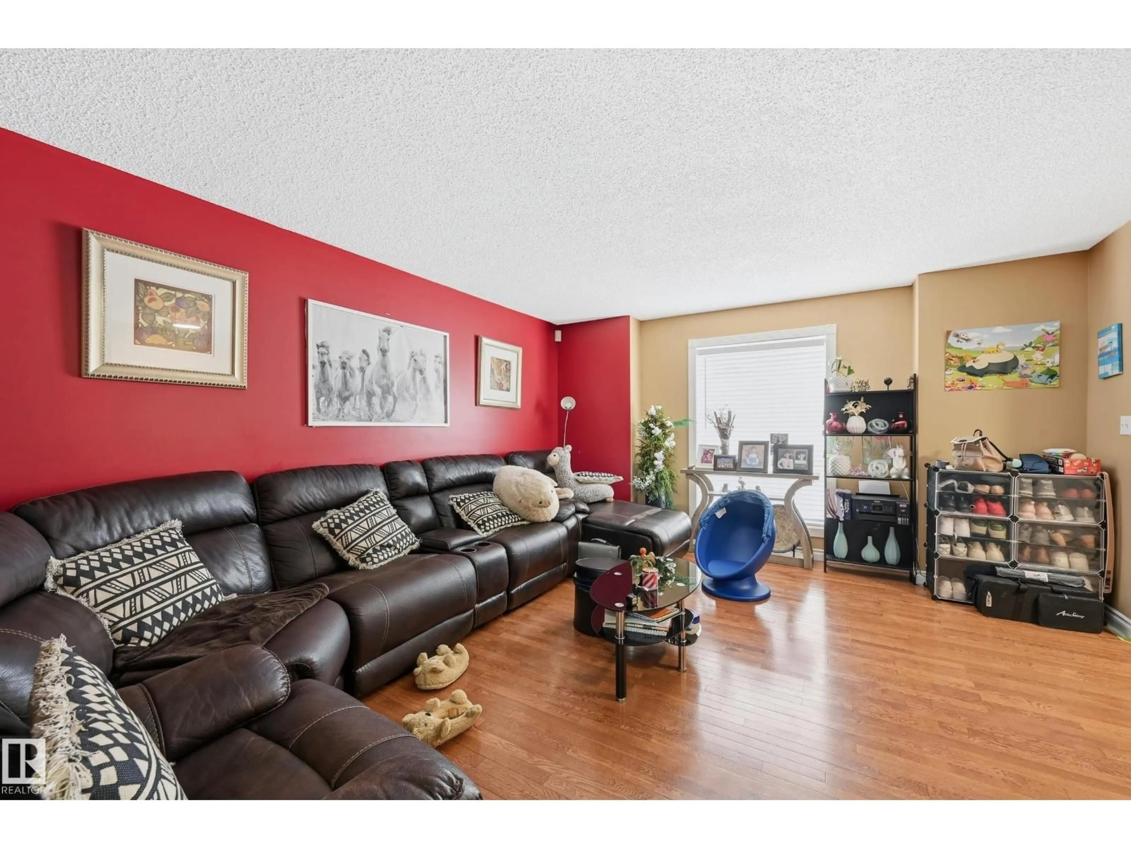 Living room with furniture, wood/laminate floor for NW - 3010 32 AV, Edmonton Alberta T6T1X1