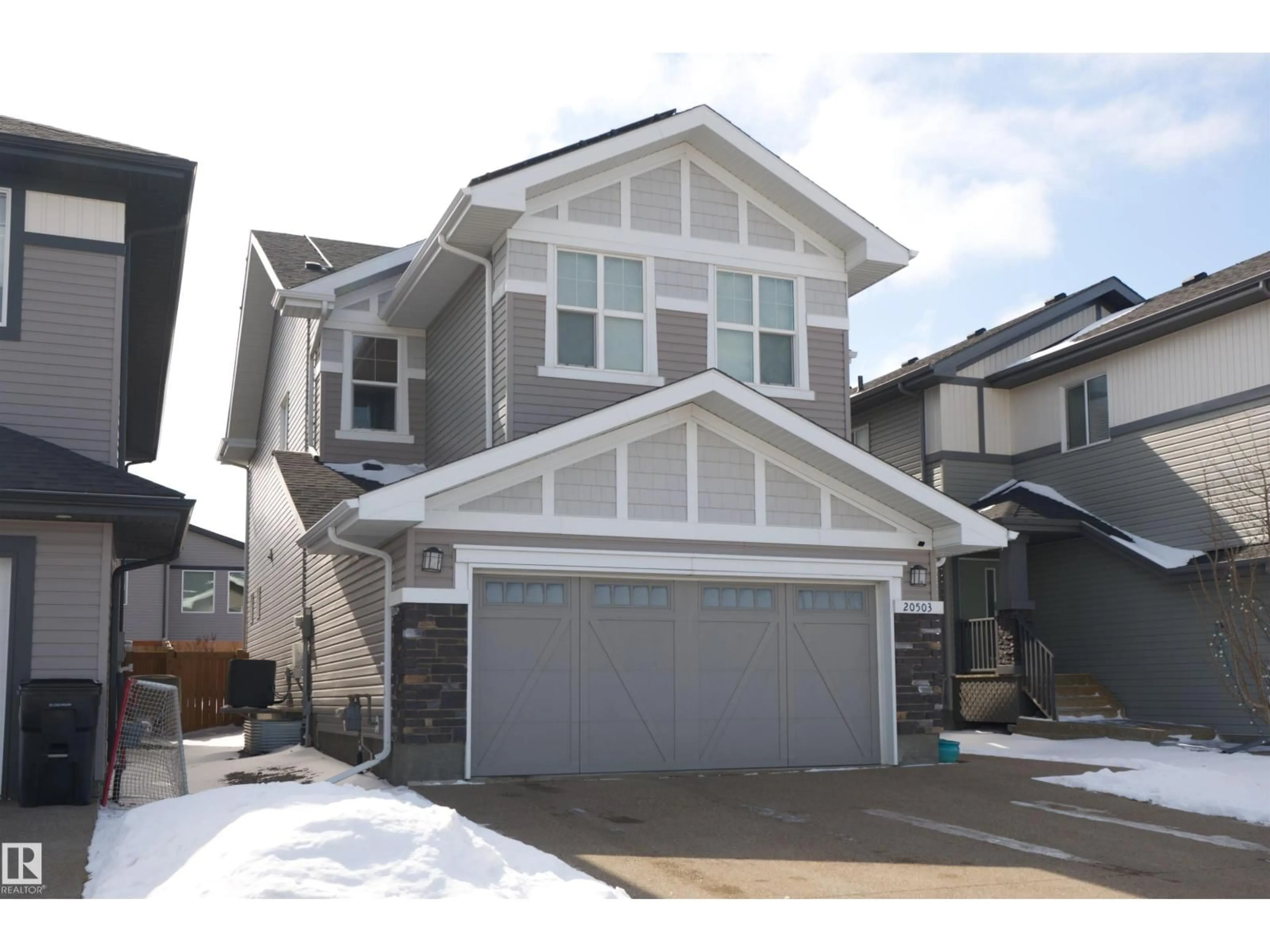 Home with vinyl exterior material, street for 20503 99 AV, Edmonton Alberta T5T7L5