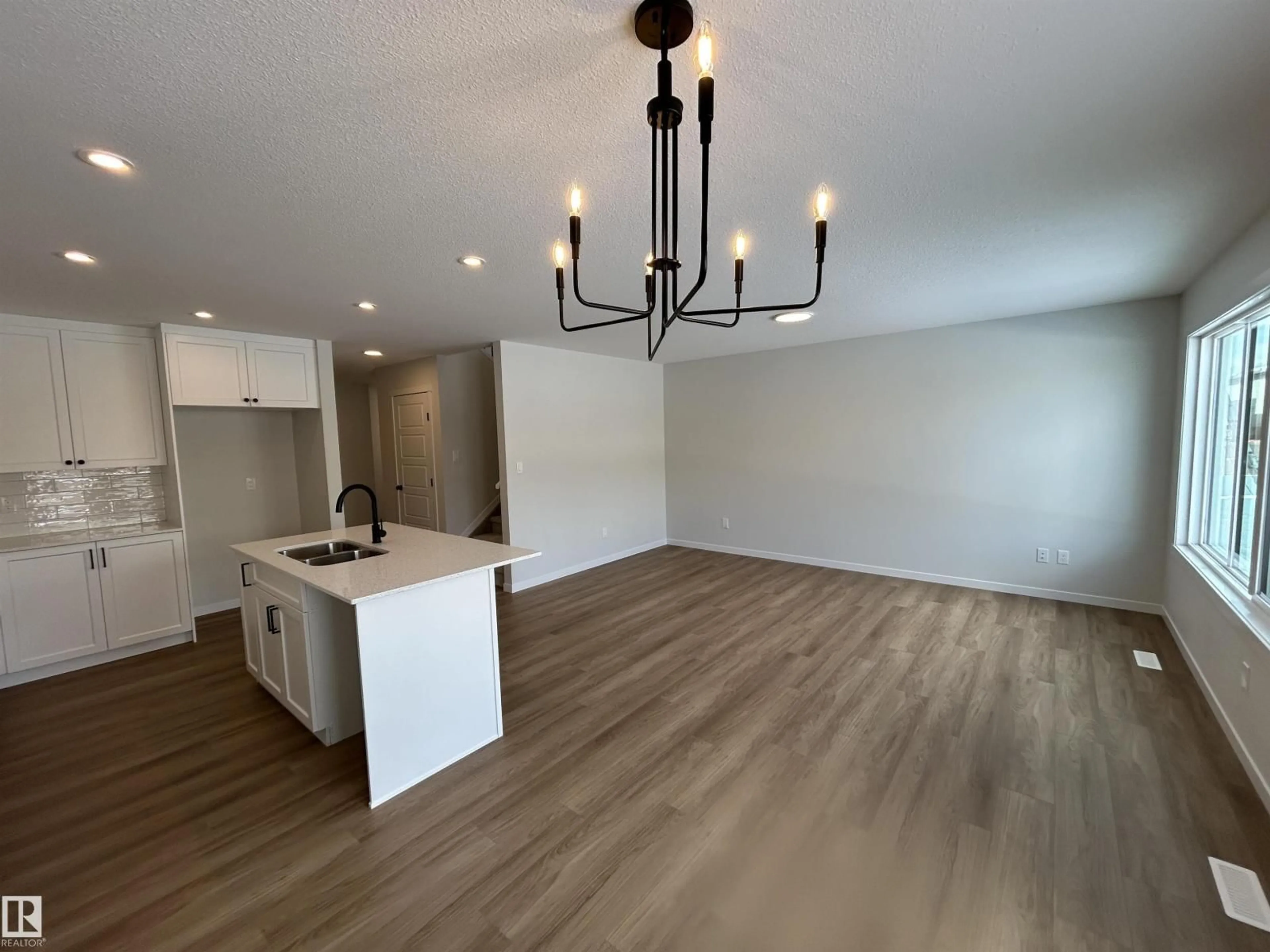 Open concept kitchen, wood/laminate floor for 1186 SOUTH CREEK WD, Stony Plain Alberta T7Z0P5