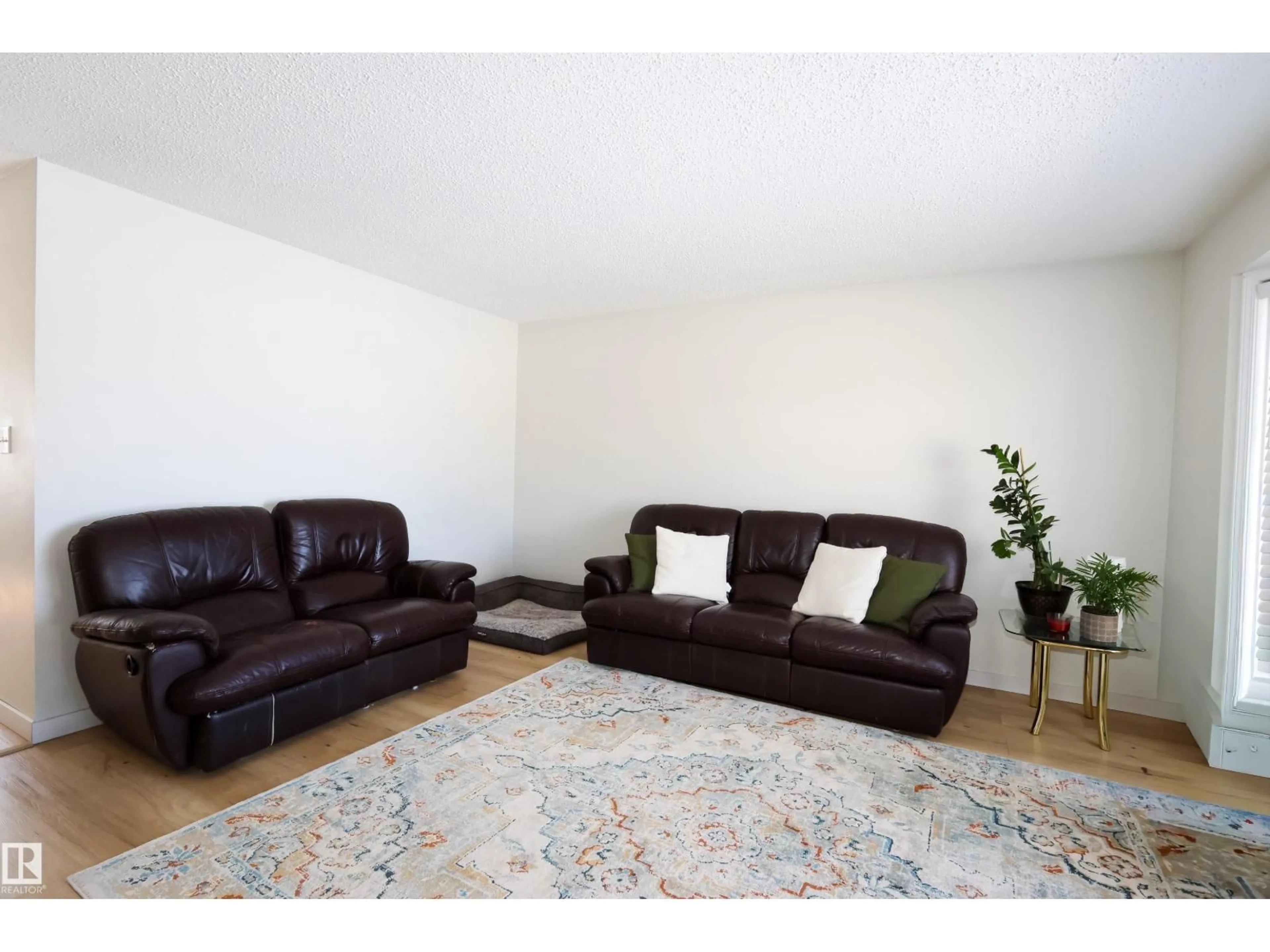 Living room with furniture, wood/laminate floor for 8703 102 AV, Morinville Alberta T8R1B7
