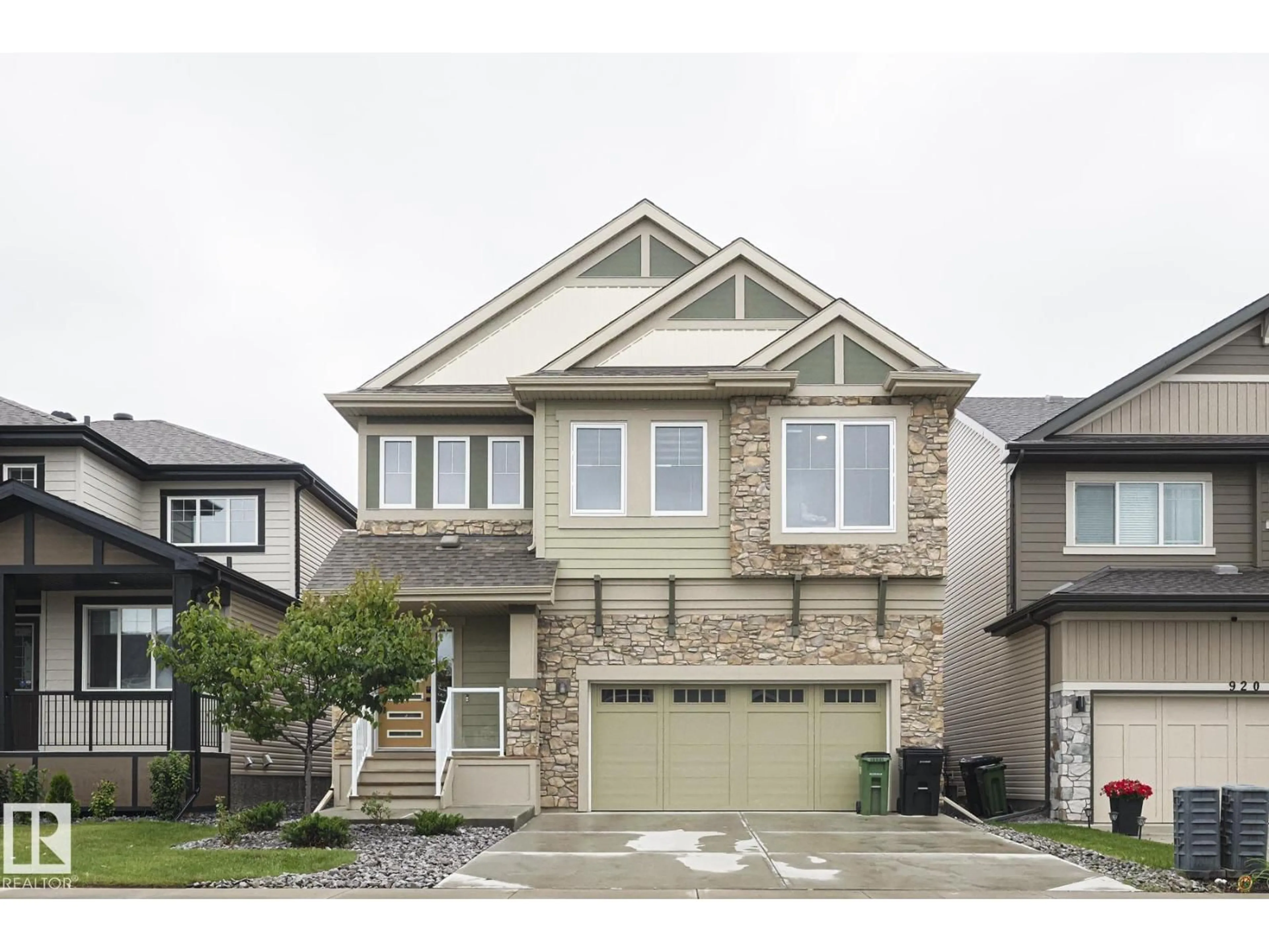 Home with vinyl exterior material, street for SW - 924 173 ST, Edmonton Alberta T6W3V5