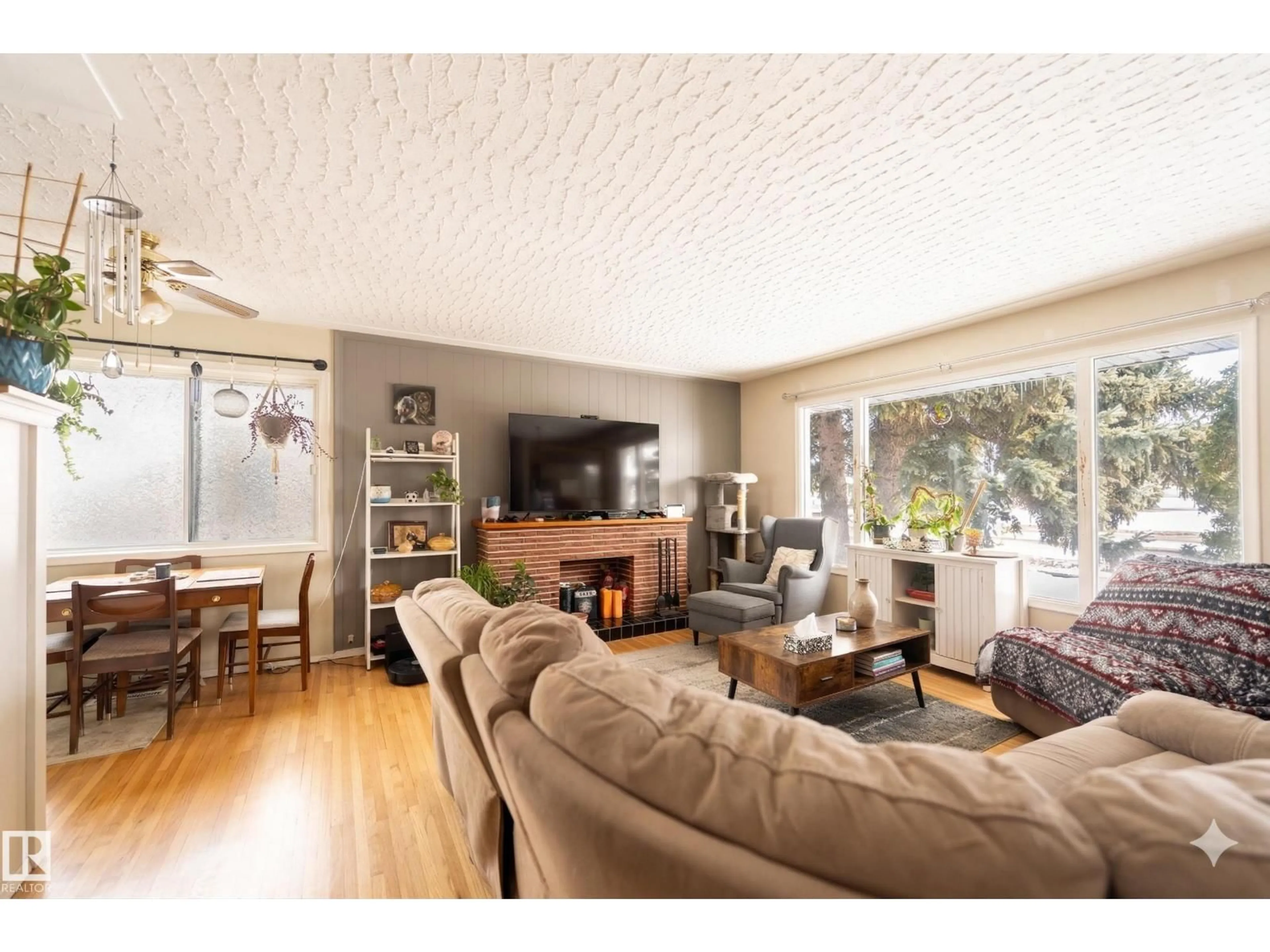 Living room with furniture, wood/laminate floor for NW - 13524 113A ST, Edmonton Alberta T5R5C4