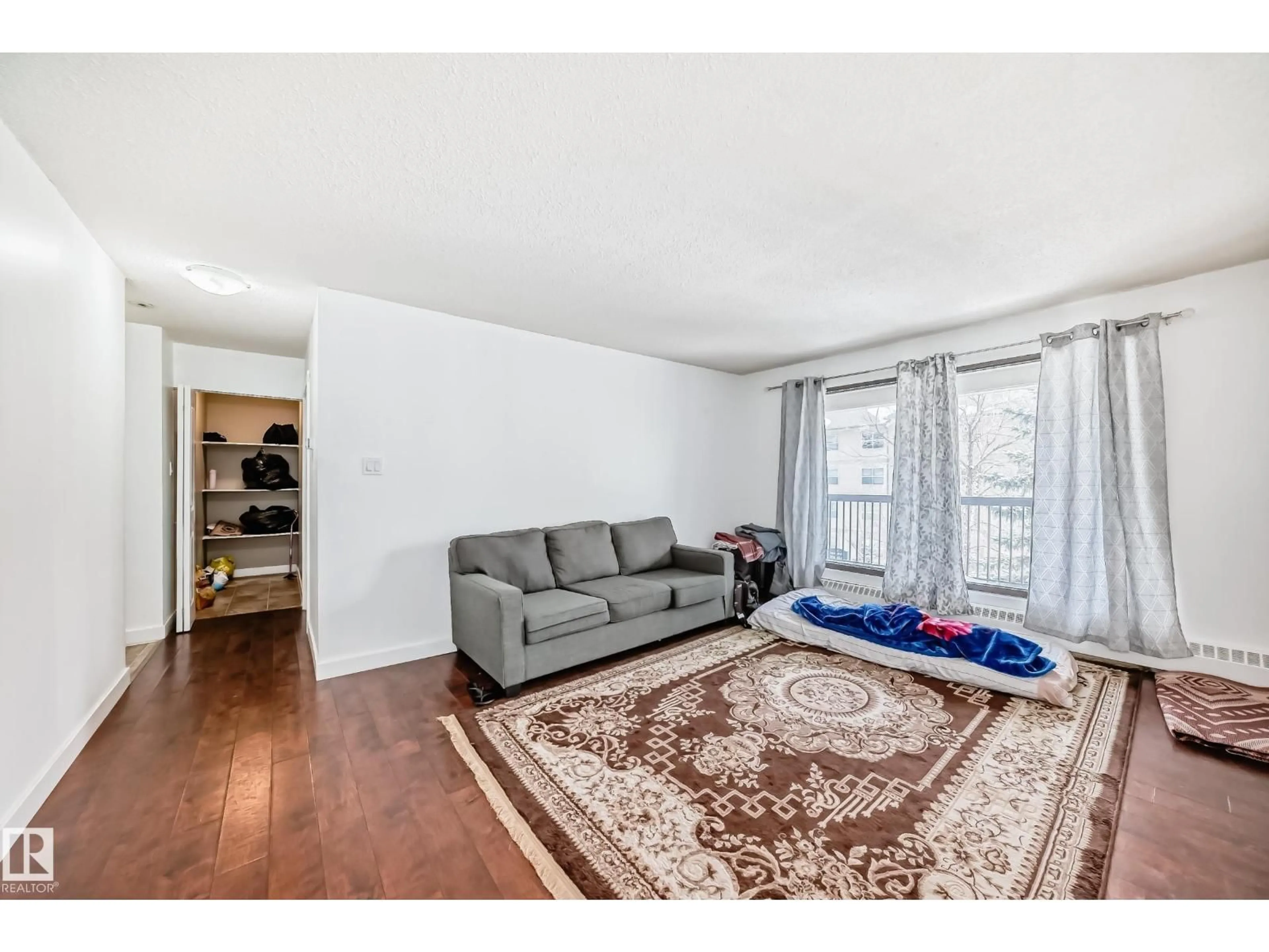 Living room with furniture, wood/laminate floor for #305 - 12841 65 ST, Edmonton Alberta T5A4N4