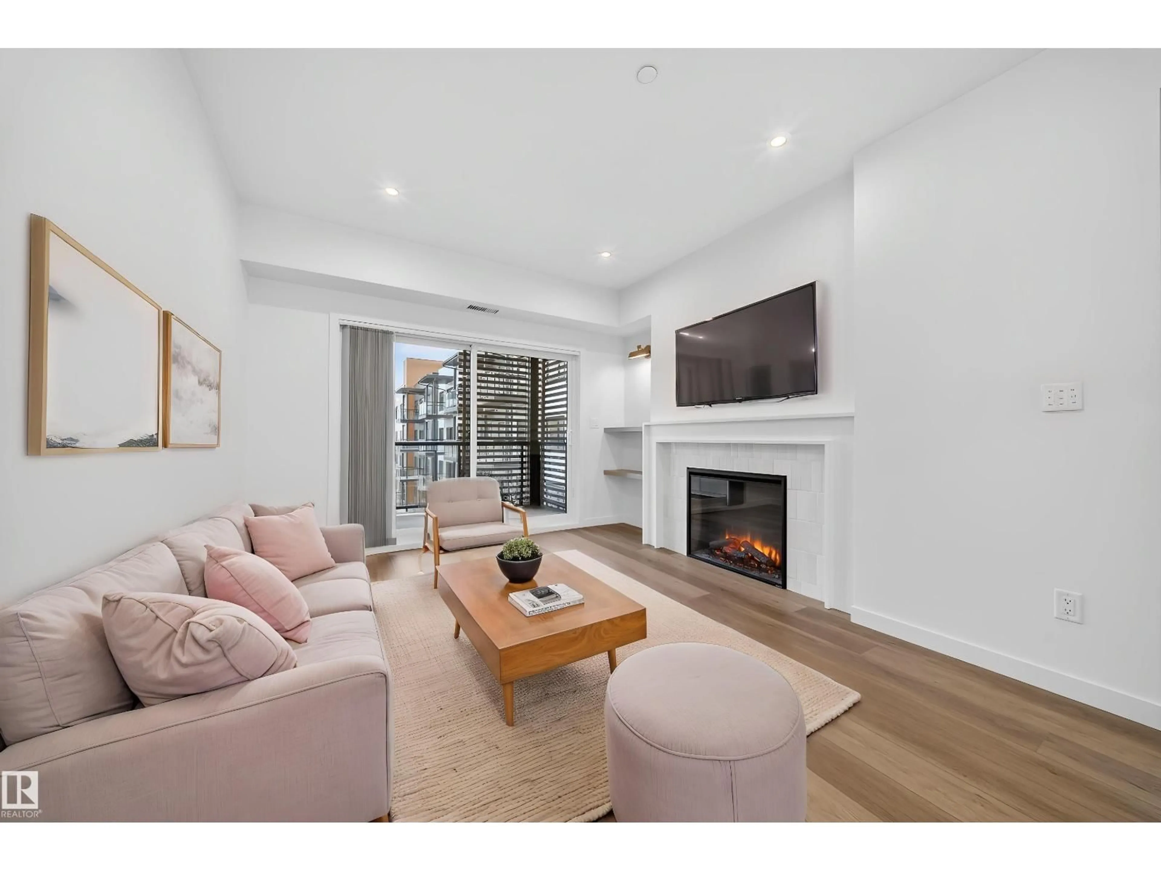 Living room with furniture, wood/laminate floor for #301 - 7459 MAY CM, Edmonton Alberta T6R0X6